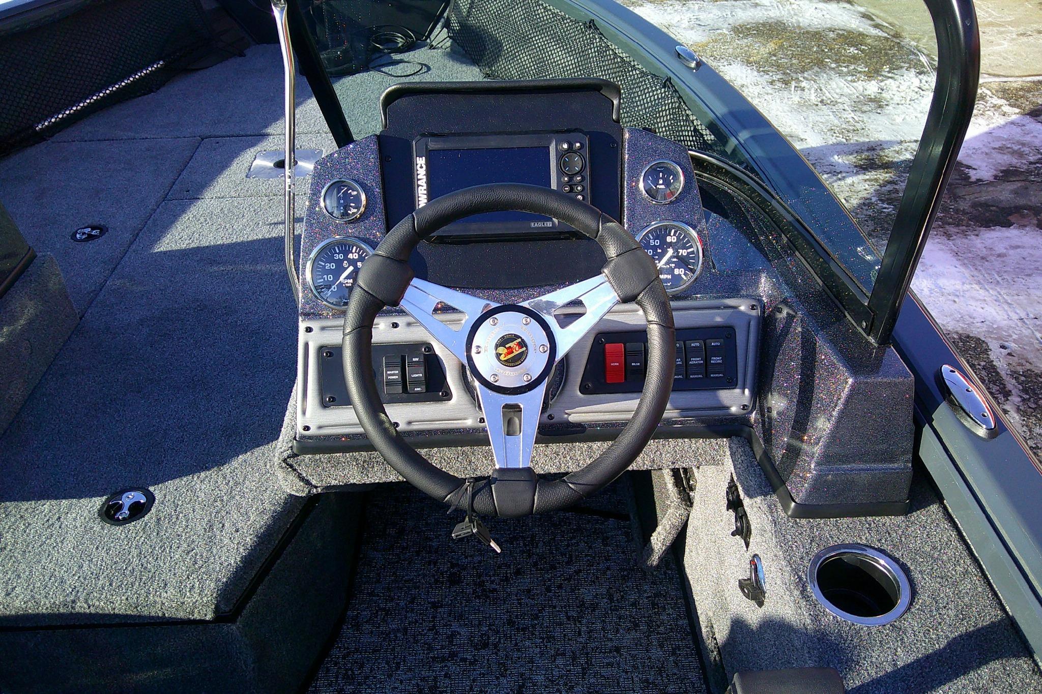 2026 Ranger VS1882SC Reata boat dashboard with steering wheel and control panel.