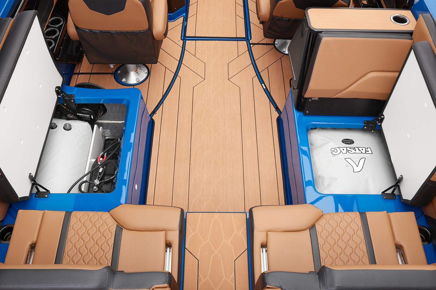 Manufacturer Provided Image: 2026 Yamaha Boats 255XD interior with tan seats, blue accents, and storage compartments.