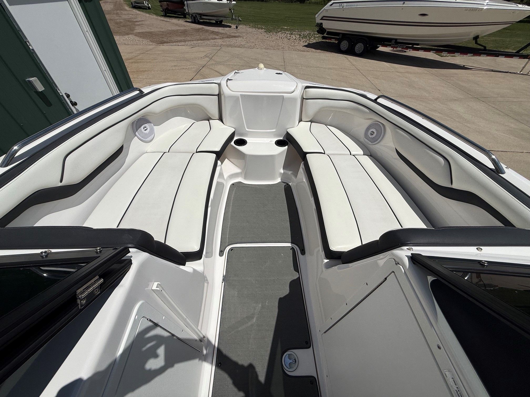 The image shows the interior of a Yamaha SX210 boat with white seating.