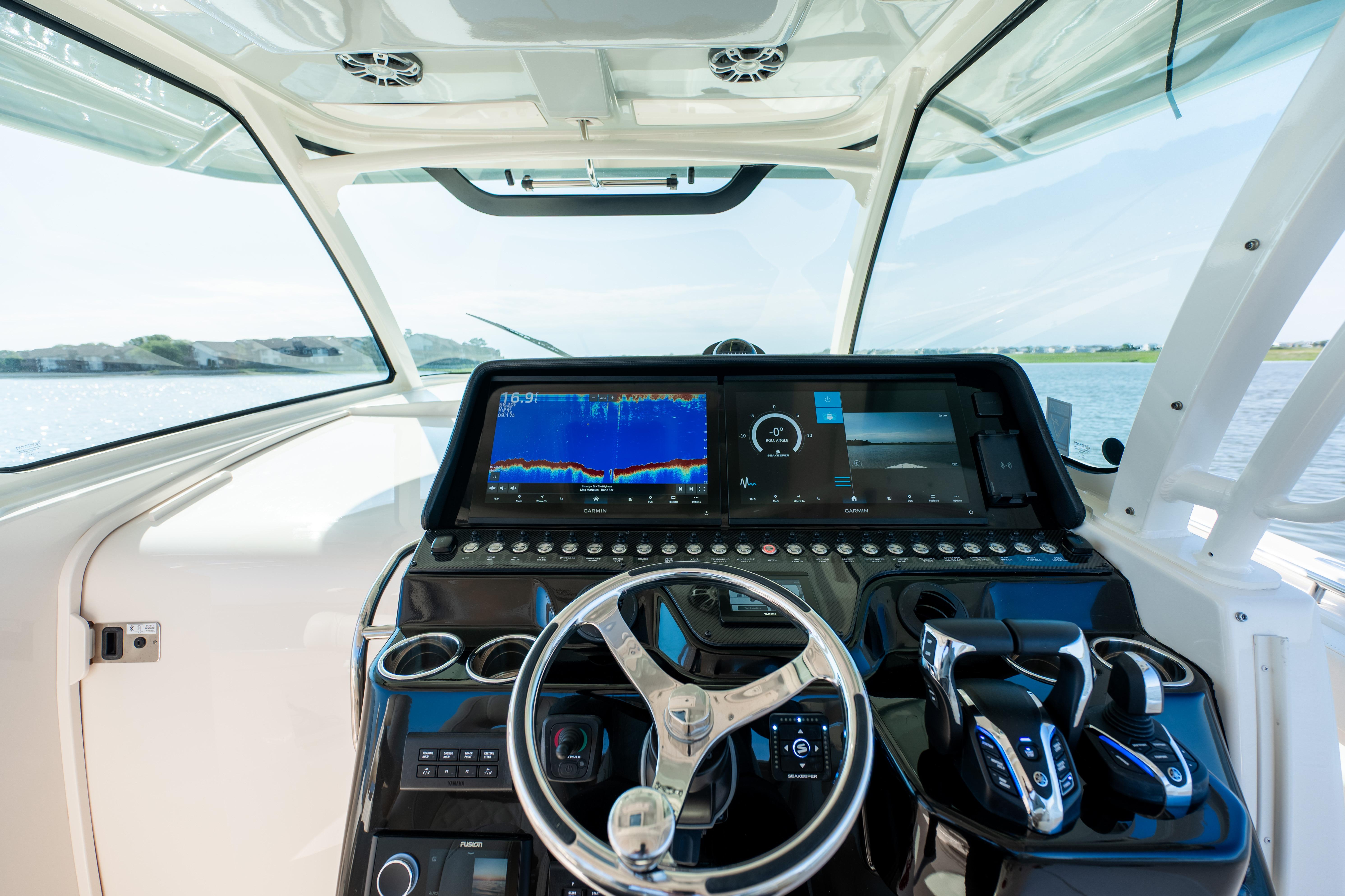 Helm of 2025 Grady-White Canyon 386 boat with advanced navigation displays.