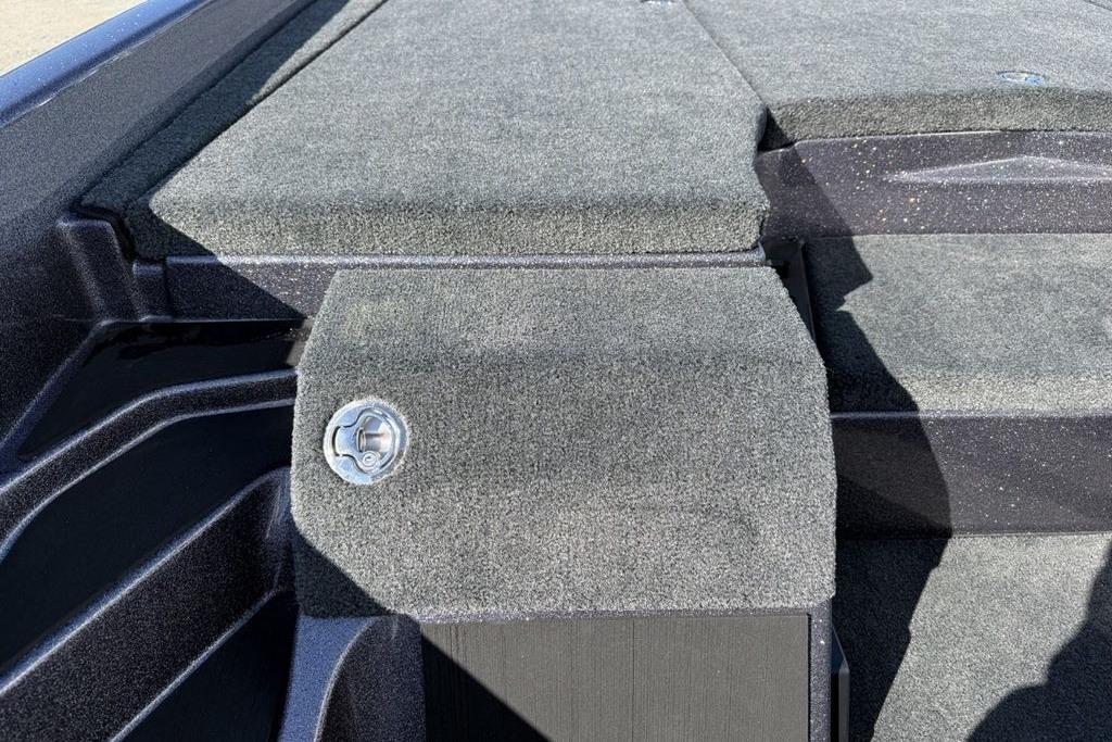 Carpeted deck of 2026 Skeeter ZXE21 boat with latch detail.