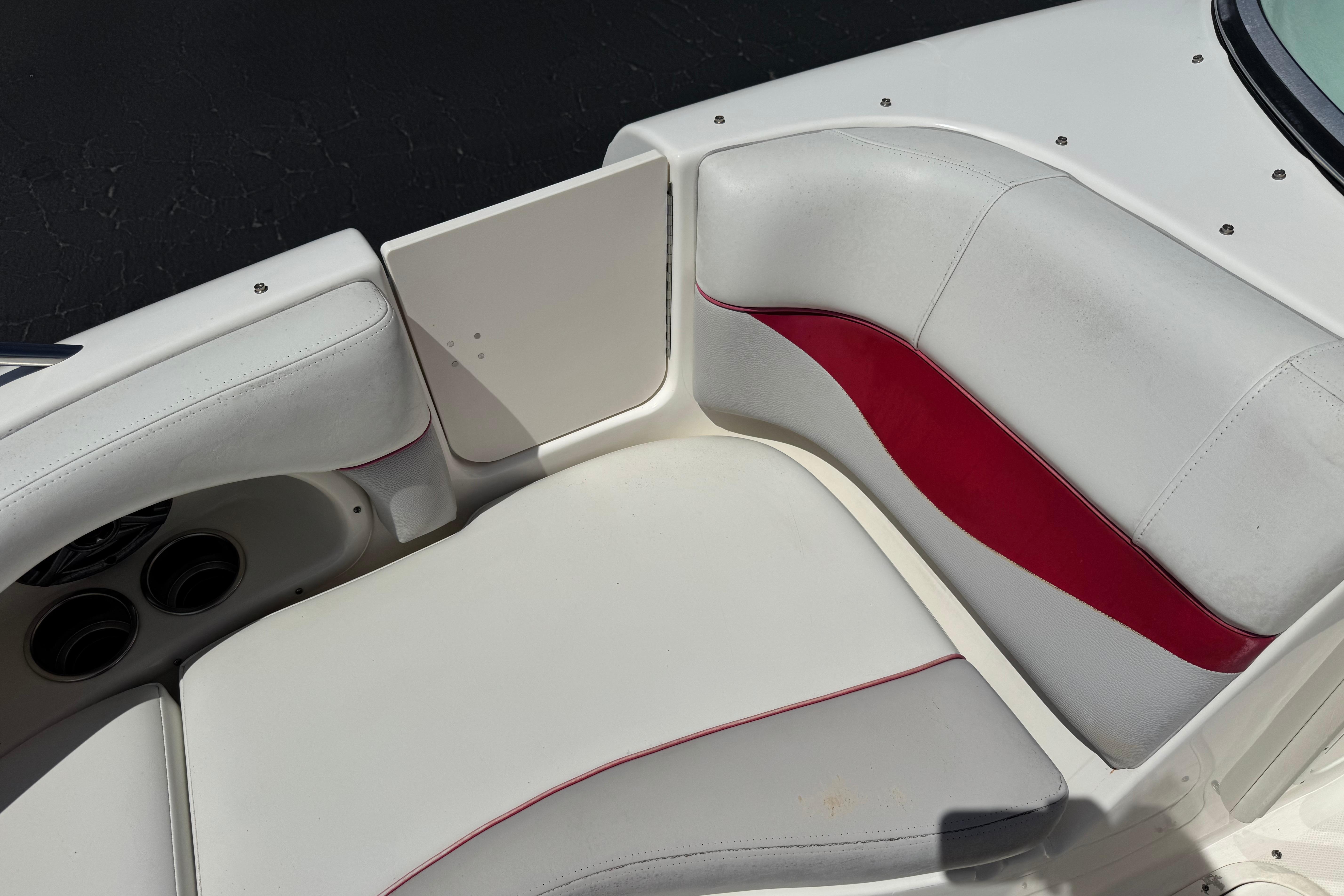 White and red seating area on a 2010 Bryant 255 boat.