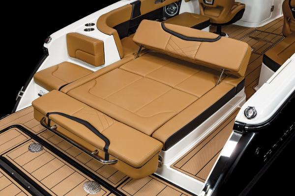 2024 Chaparral 28 Surf boat with luxurious tan seating and sleek design.