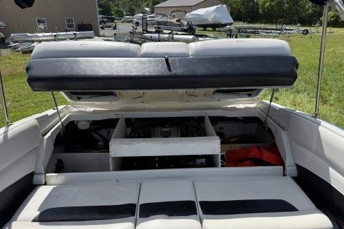 2012 Crownline 215 SS boat with open engine compartment, showcasing interior details.