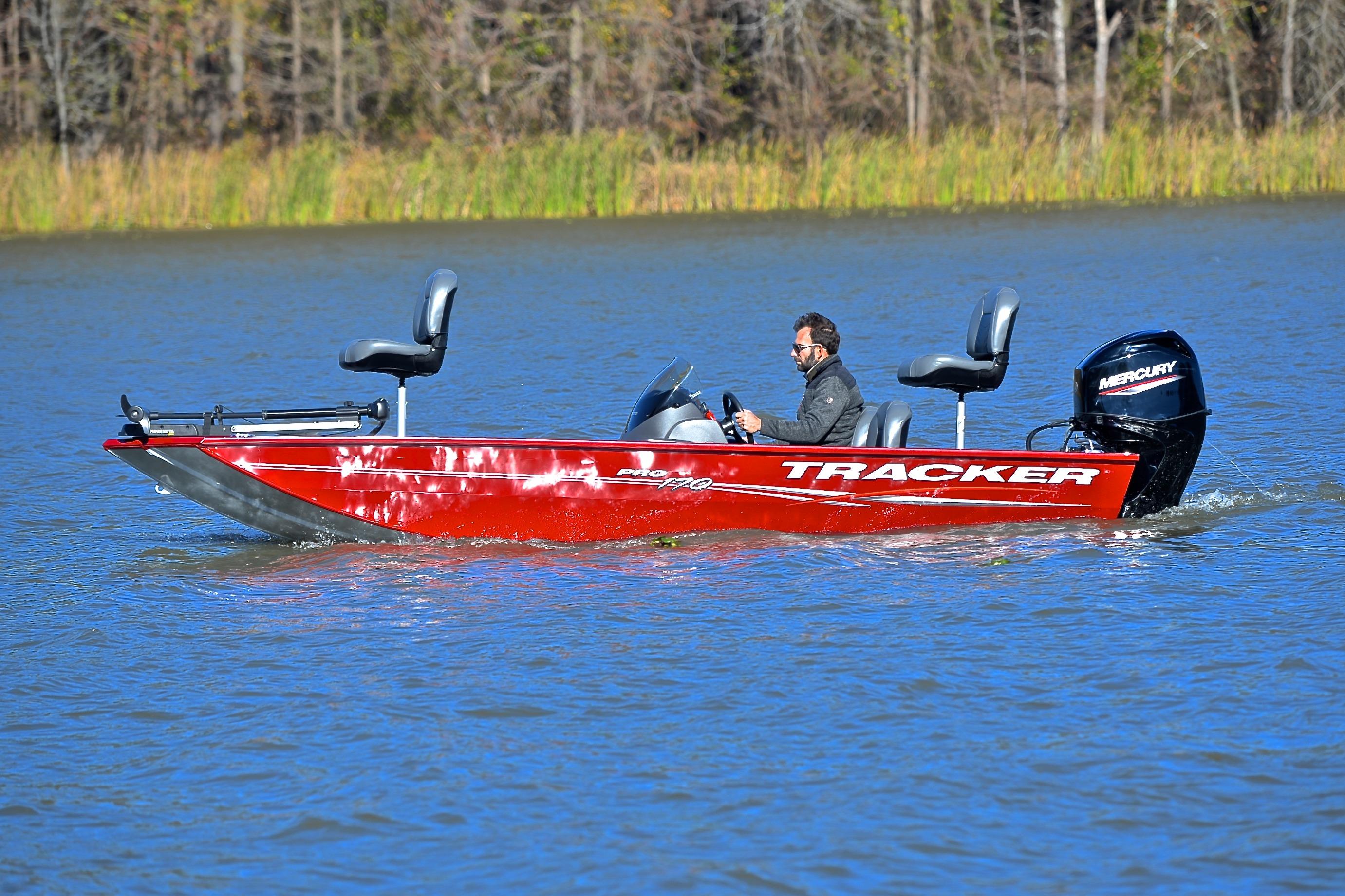 2024 Tracker Pro 170 boat cruising on a lake with a Mercury engine.