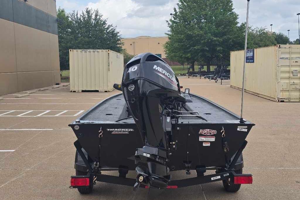 2026 Tracker Panfish 17 boat with Mercury engine in parking lot.