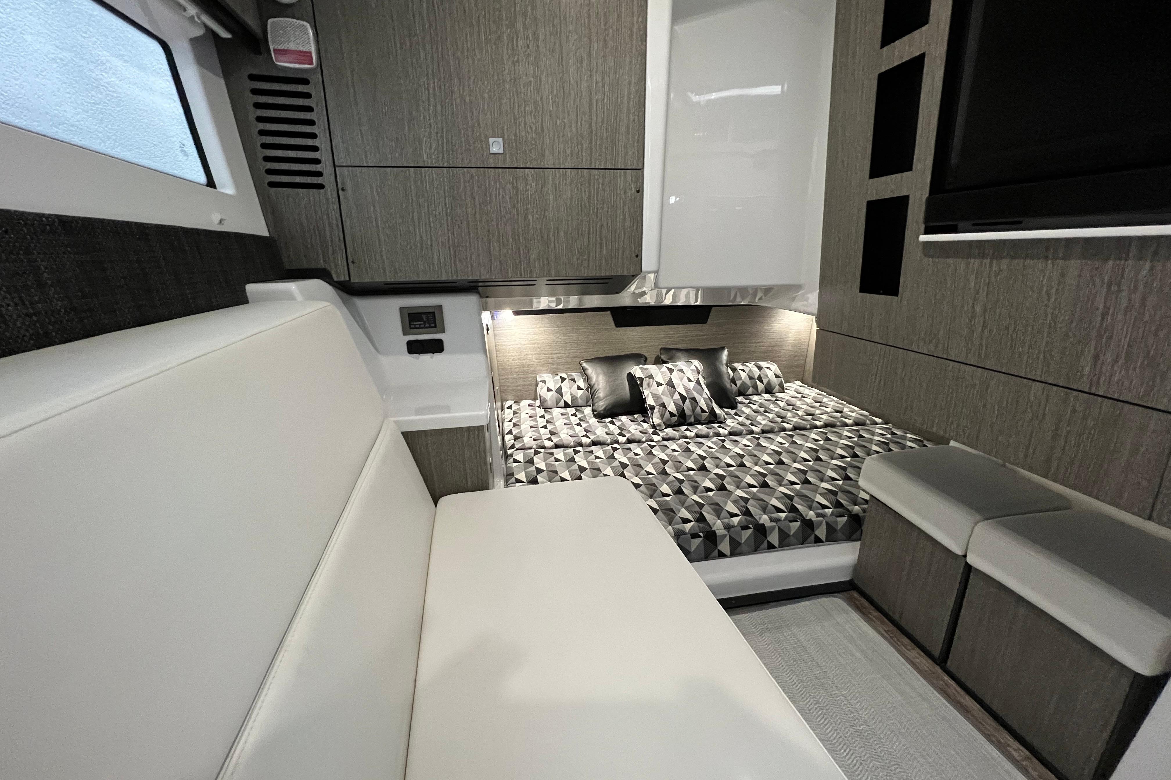 Luxurious interior of 2023 Monterey 378SS Super Sport boat with modern design and comfortable seating.