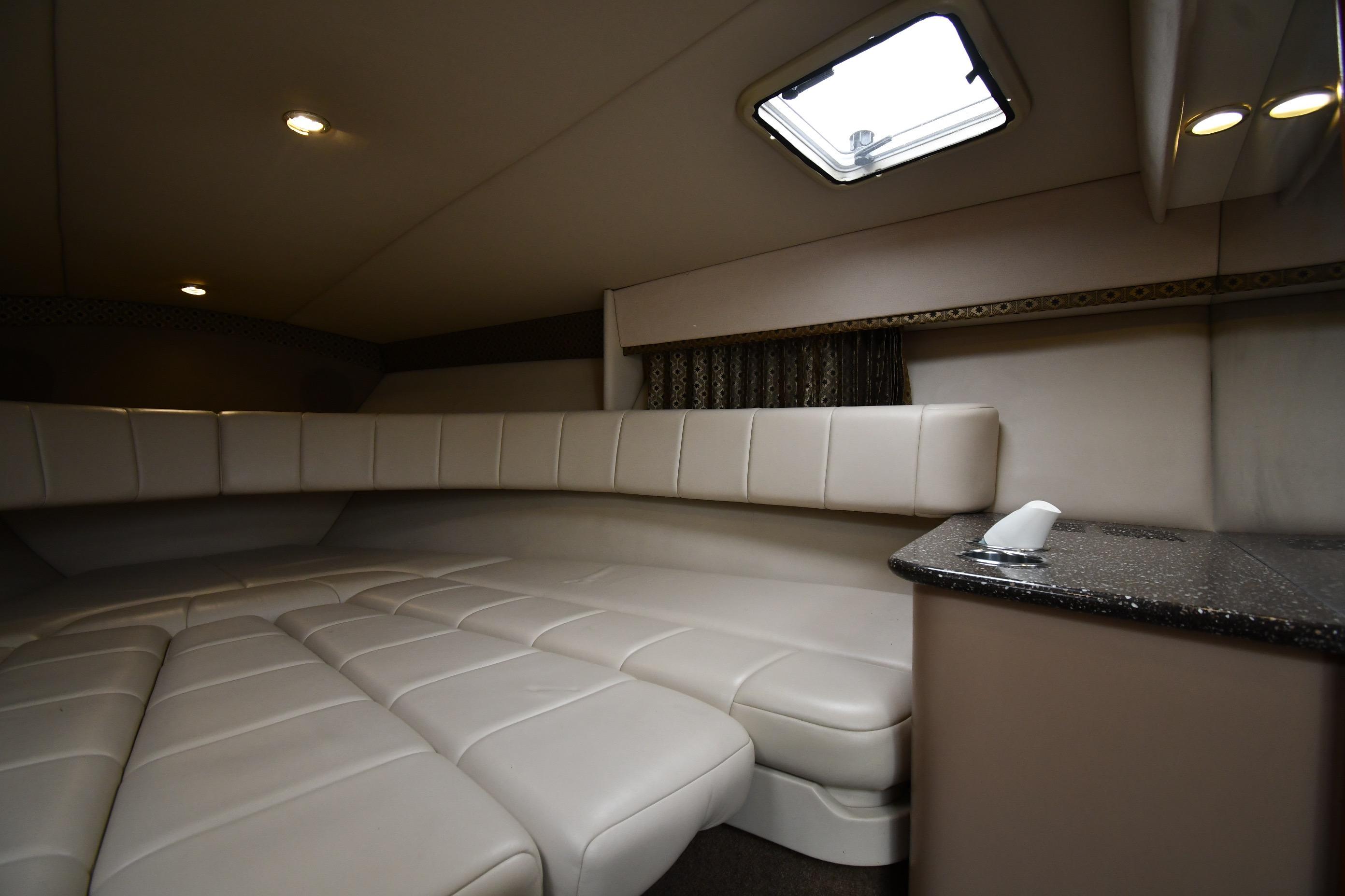 Interior of 2004 Formula 330 Sun Sport boat with plush seating and modern design.