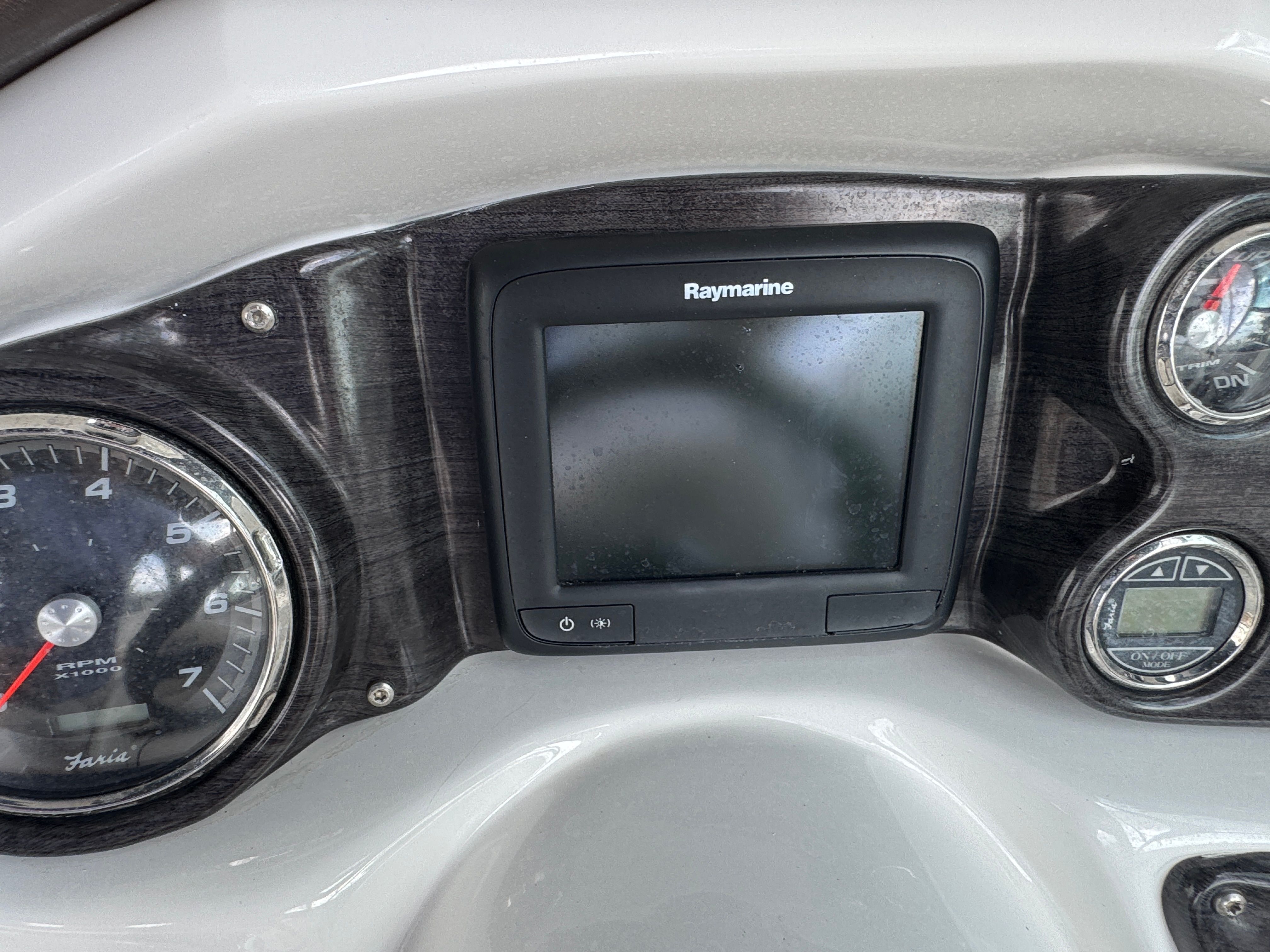 Dashboard of a 2017 Rinker QX29 BR with Raymarine display.