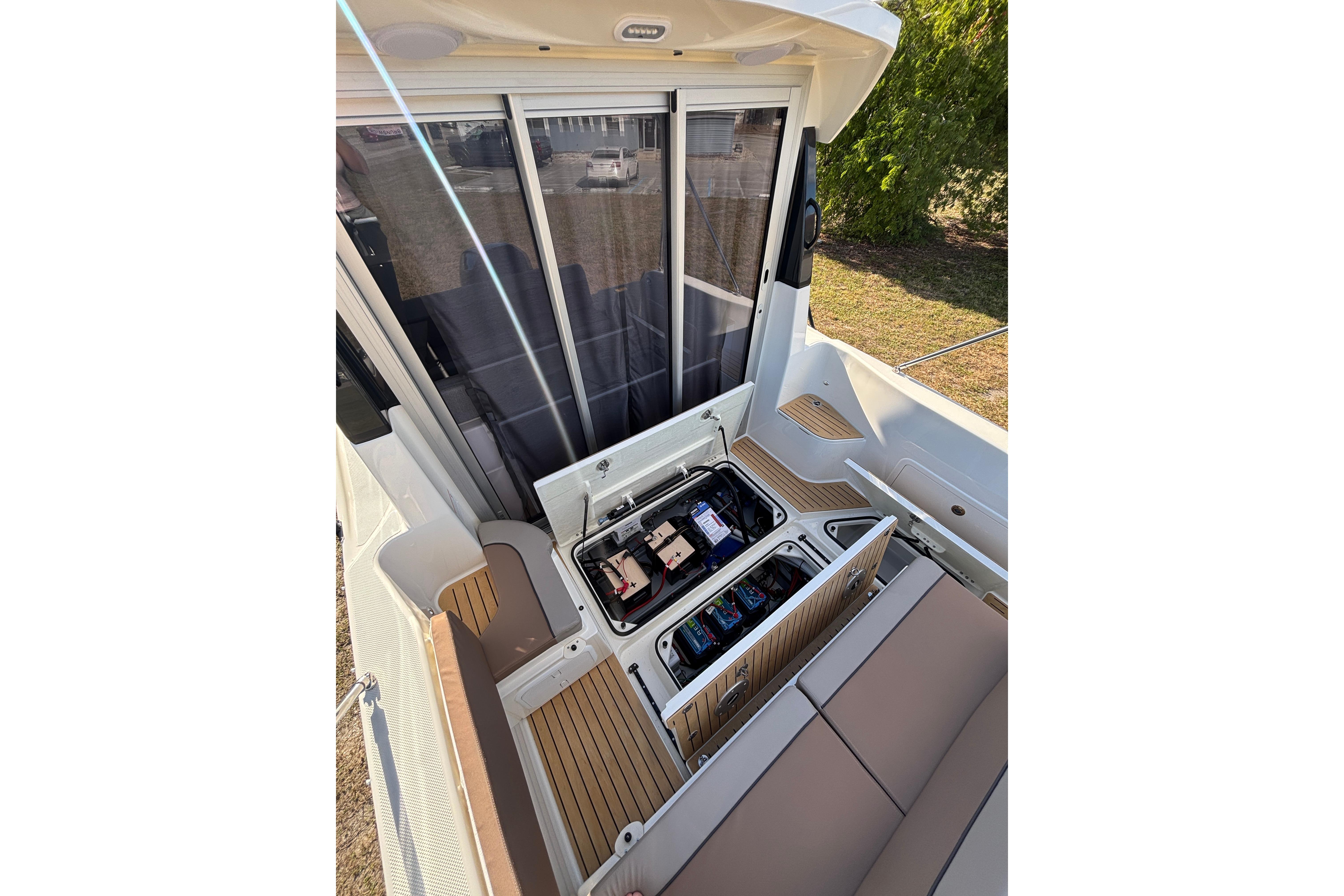 2026 Trophy T 25 Explorer boat interior with open storage compartments and seating.