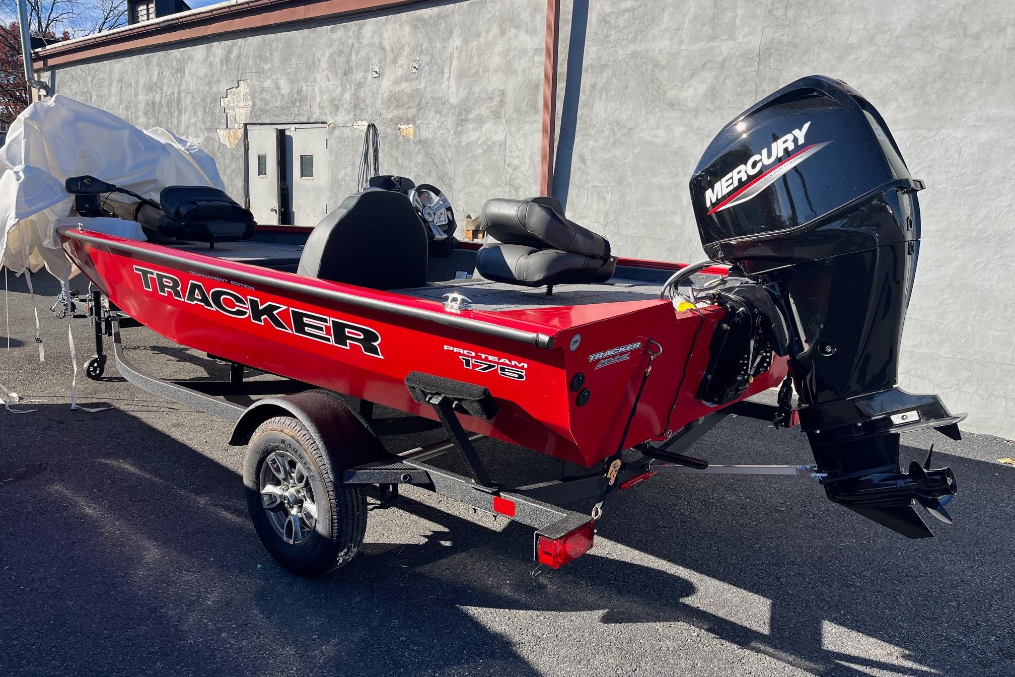 2026 Tracker Pro Team 175 boat with Mercury engine, parked outdoors.