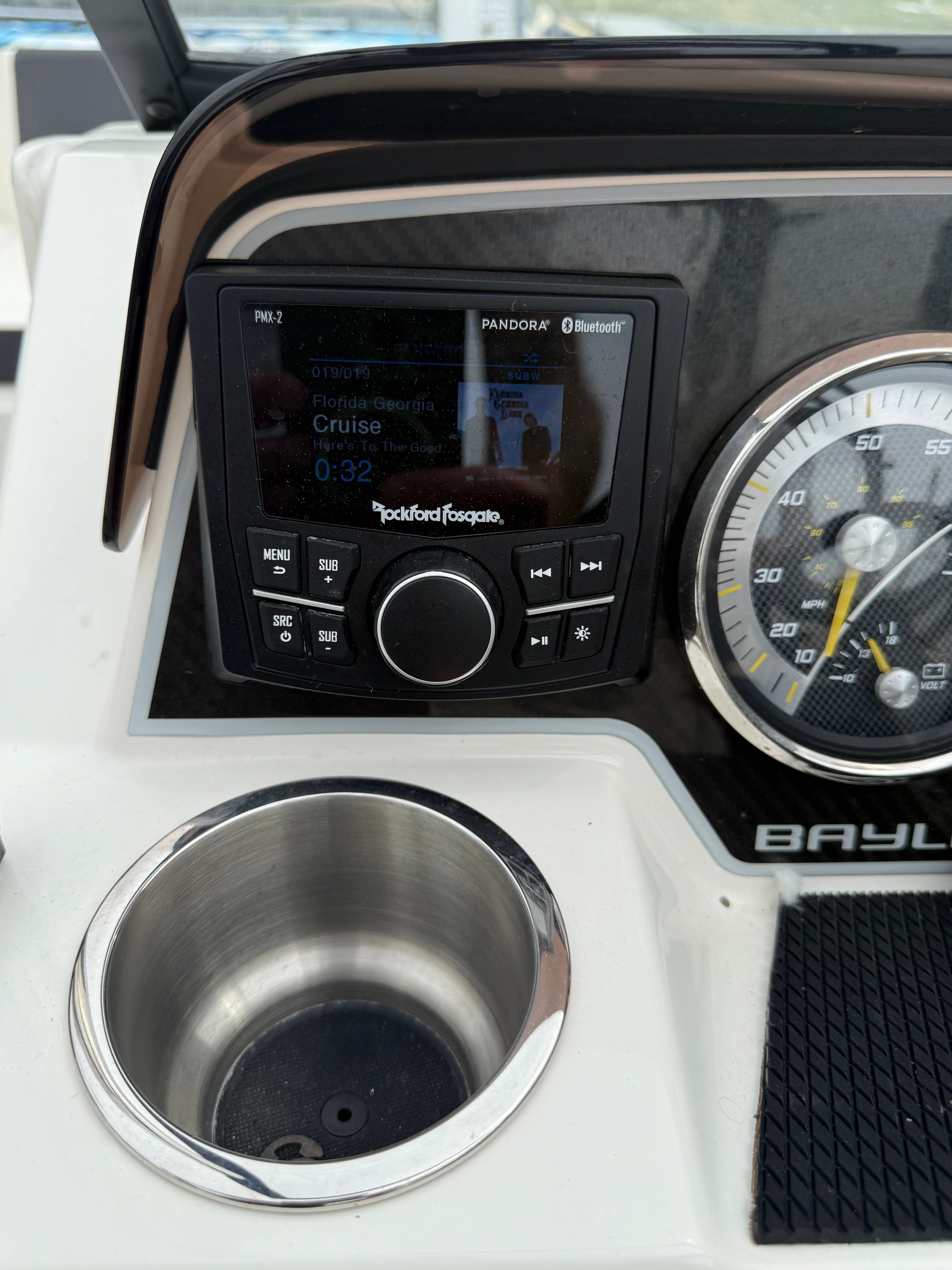 Dashboard of 2022 Bayliner DX 2250 with stereo and speedometer.