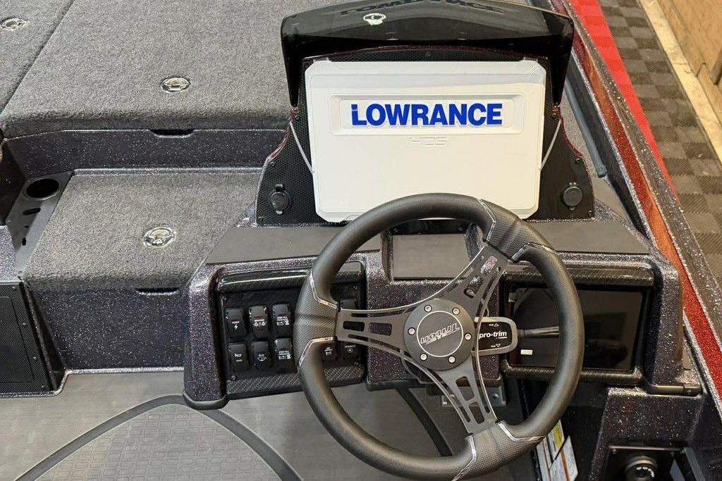 Steering console of 2026 Triton 20XP Patriot boat with Lowrance display.