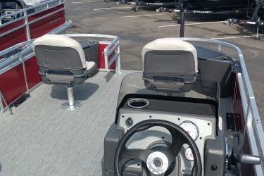 2026 Sun Tracker Bass Buggy 18 DLX pontoon boat interior with steering console and seating.