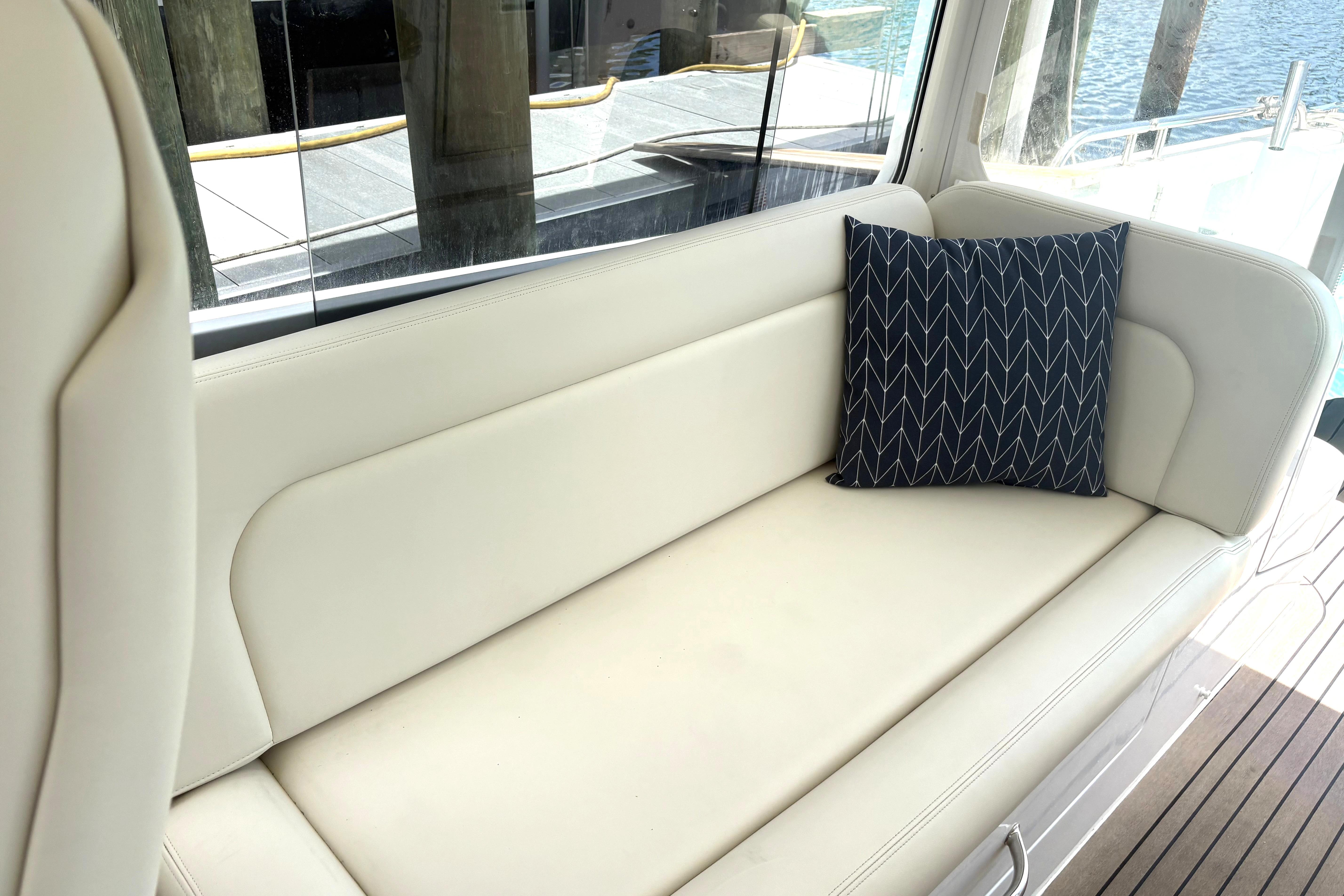 Luxurious seating on 2024 MJM 35z yacht with stylish cushion.