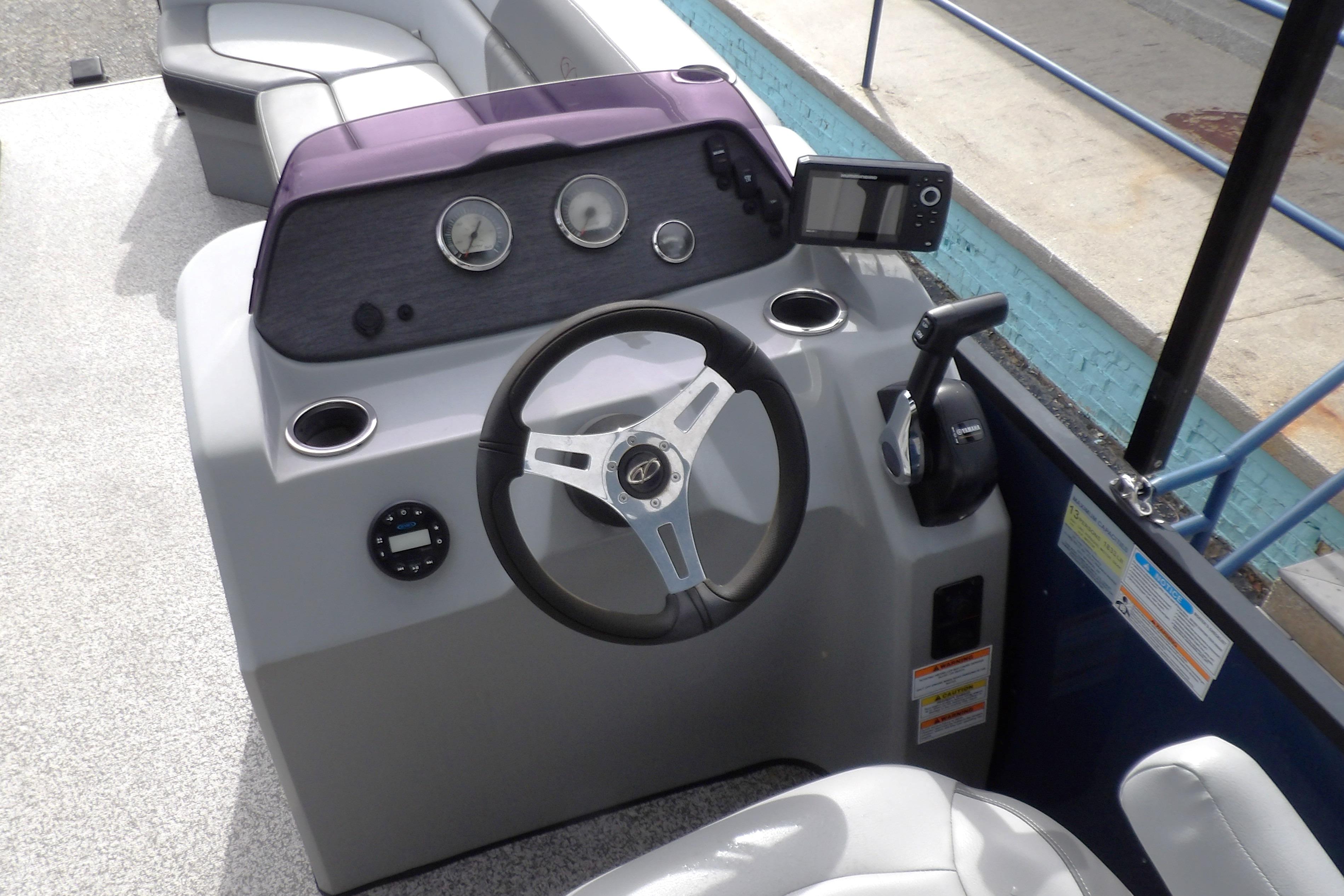 2022 Veranda Vista View 22RC boat dashboard with steering wheel and controls.