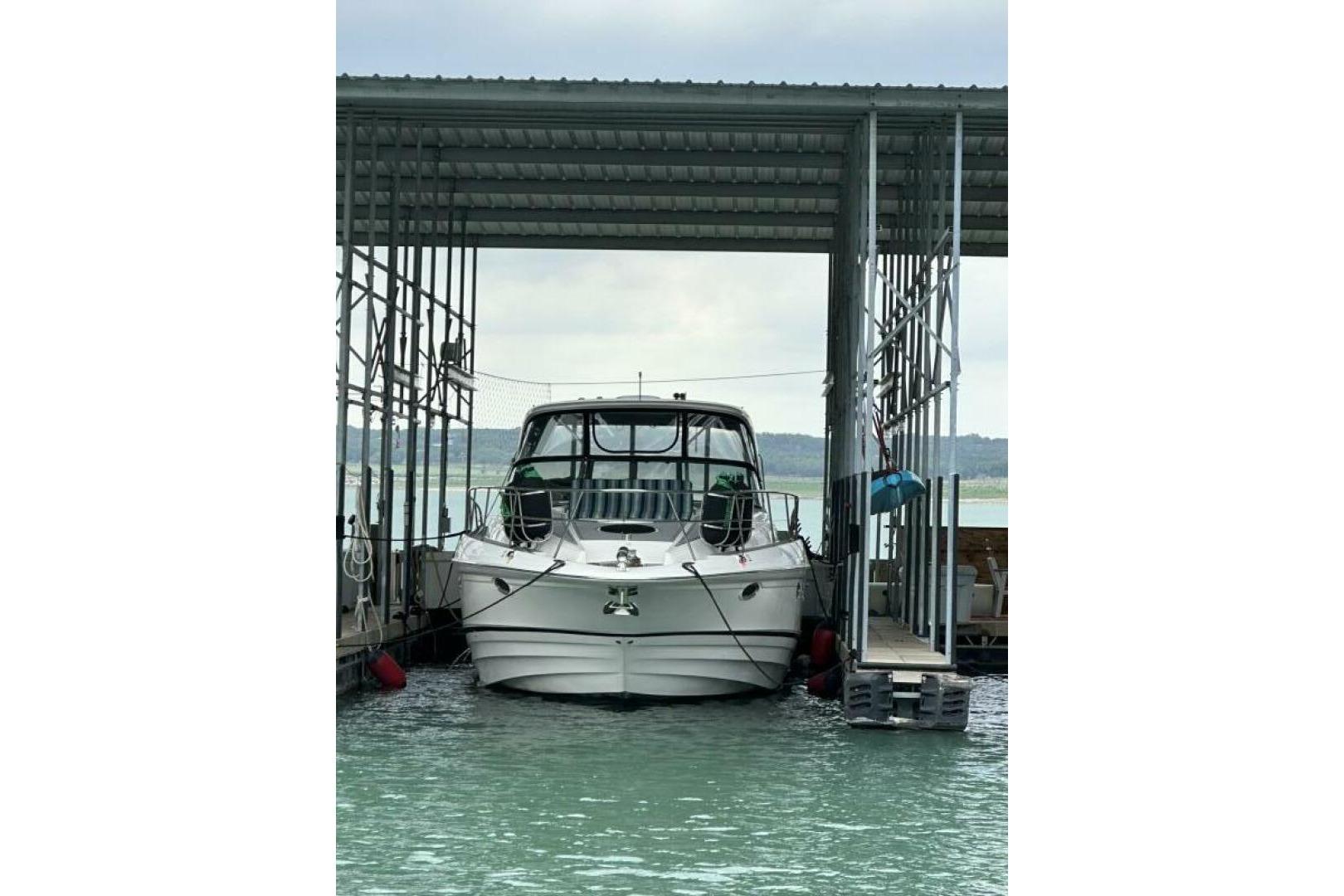 2007 Regal Commodore 4460 yacht docked in a covered marina slip.