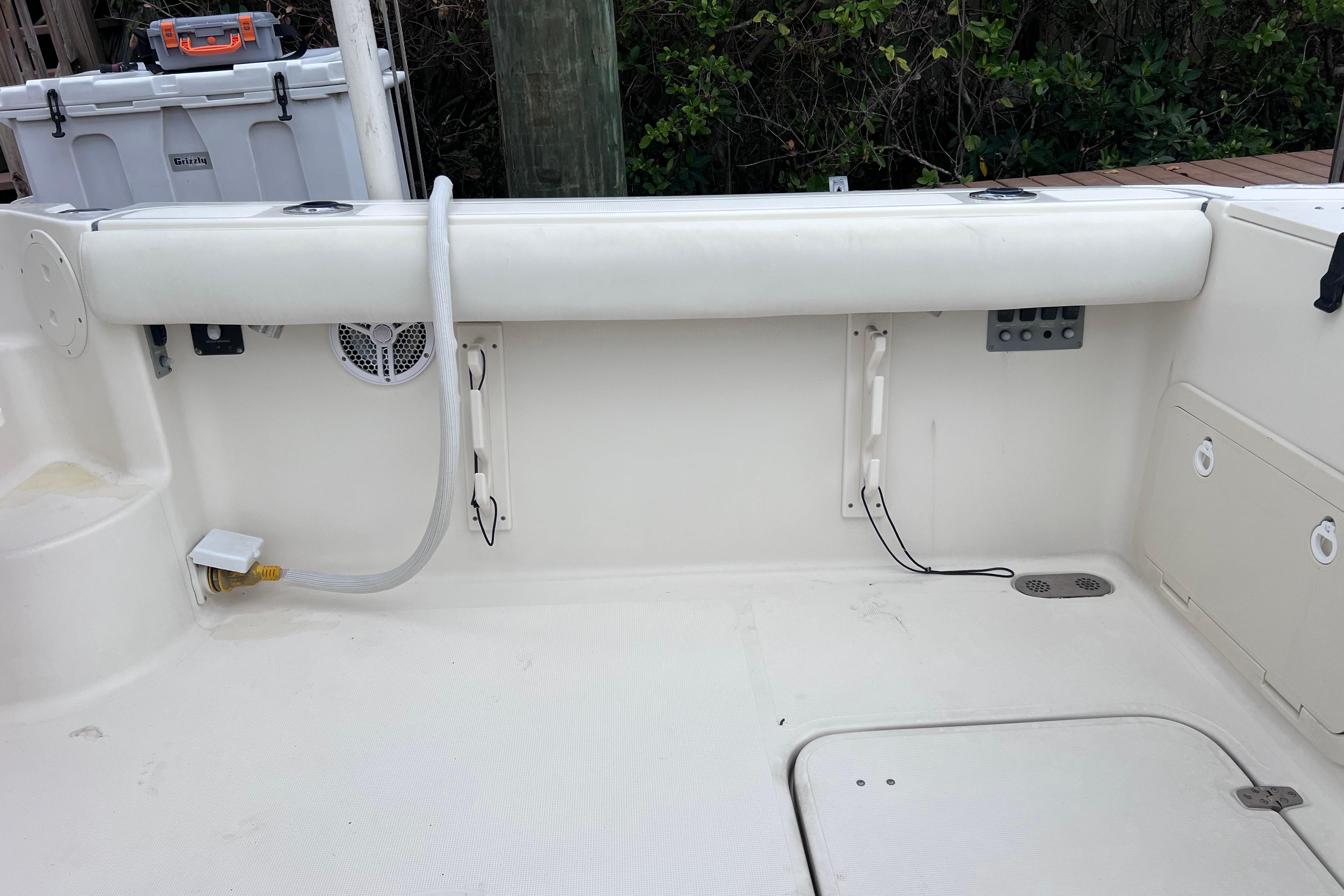2005 Pursuit 3070 Offshore boat interior with storage compartments and utility features.