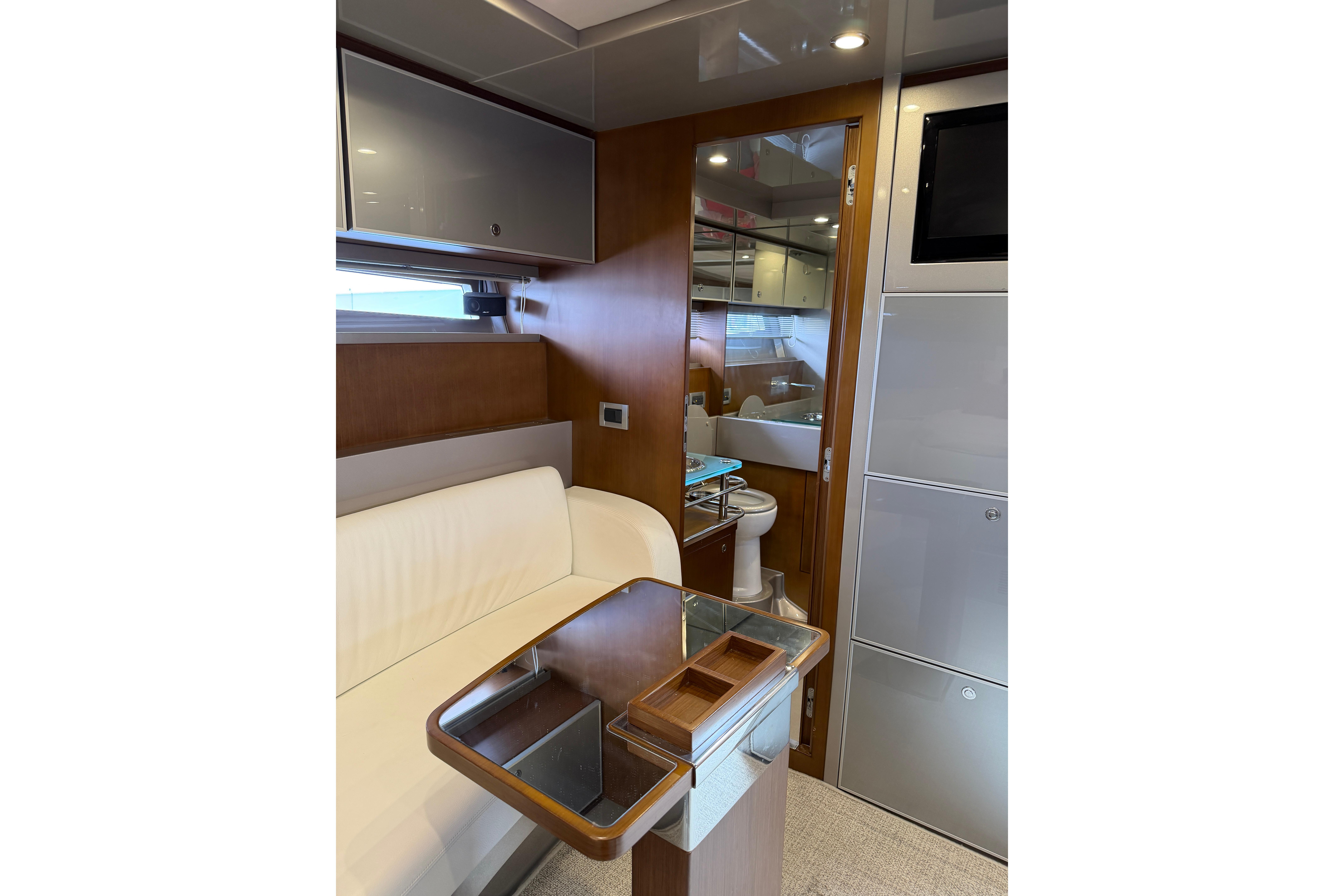 Luxurious interior of 2012 Riva 44' Rivarama yacht with elegant seating and modern amenities.