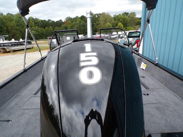 2025 Tracker Pro Guide™ V-175 Combo boat with 150 horsepower engine, docked outdoors.