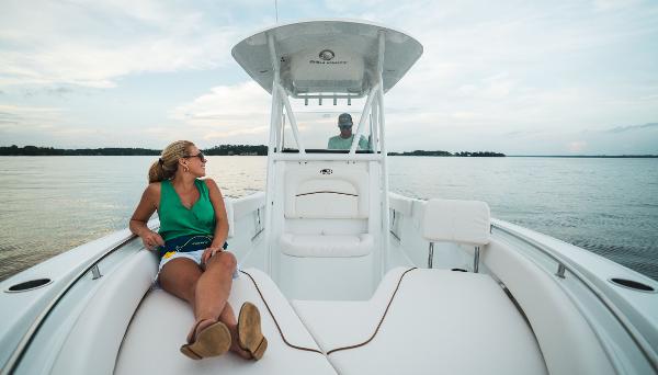 2024 Sea Hunt Ultra 234 boat with passengers enjoying the water.