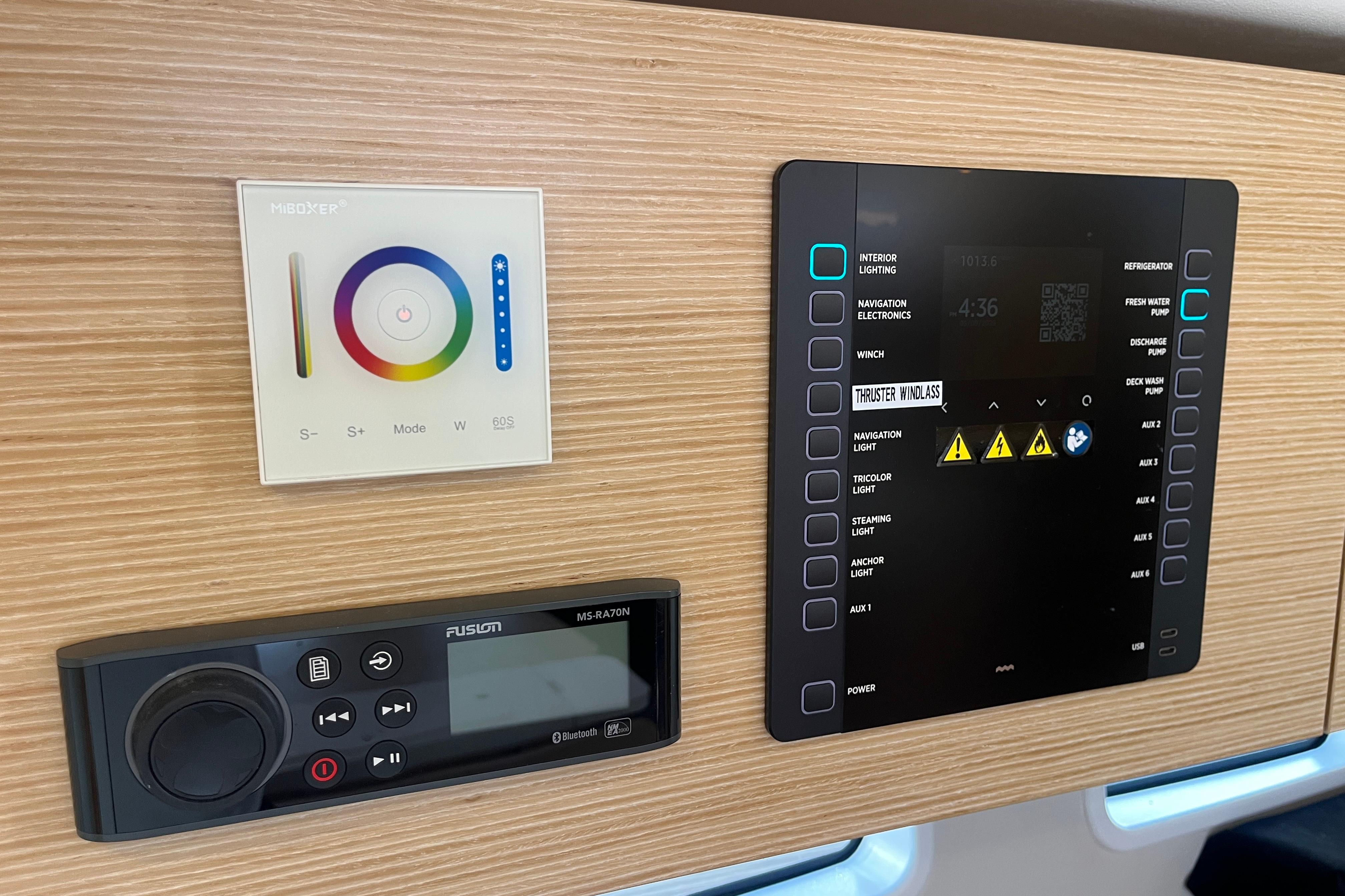 Control panel of a 2025 Hanse 360 yacht with lighting and audio systems.