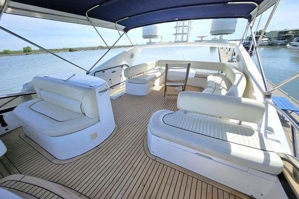 Luxurious 2005 Sunseeker Manhattan 66 yacht with spacious deck seating and elegant design.