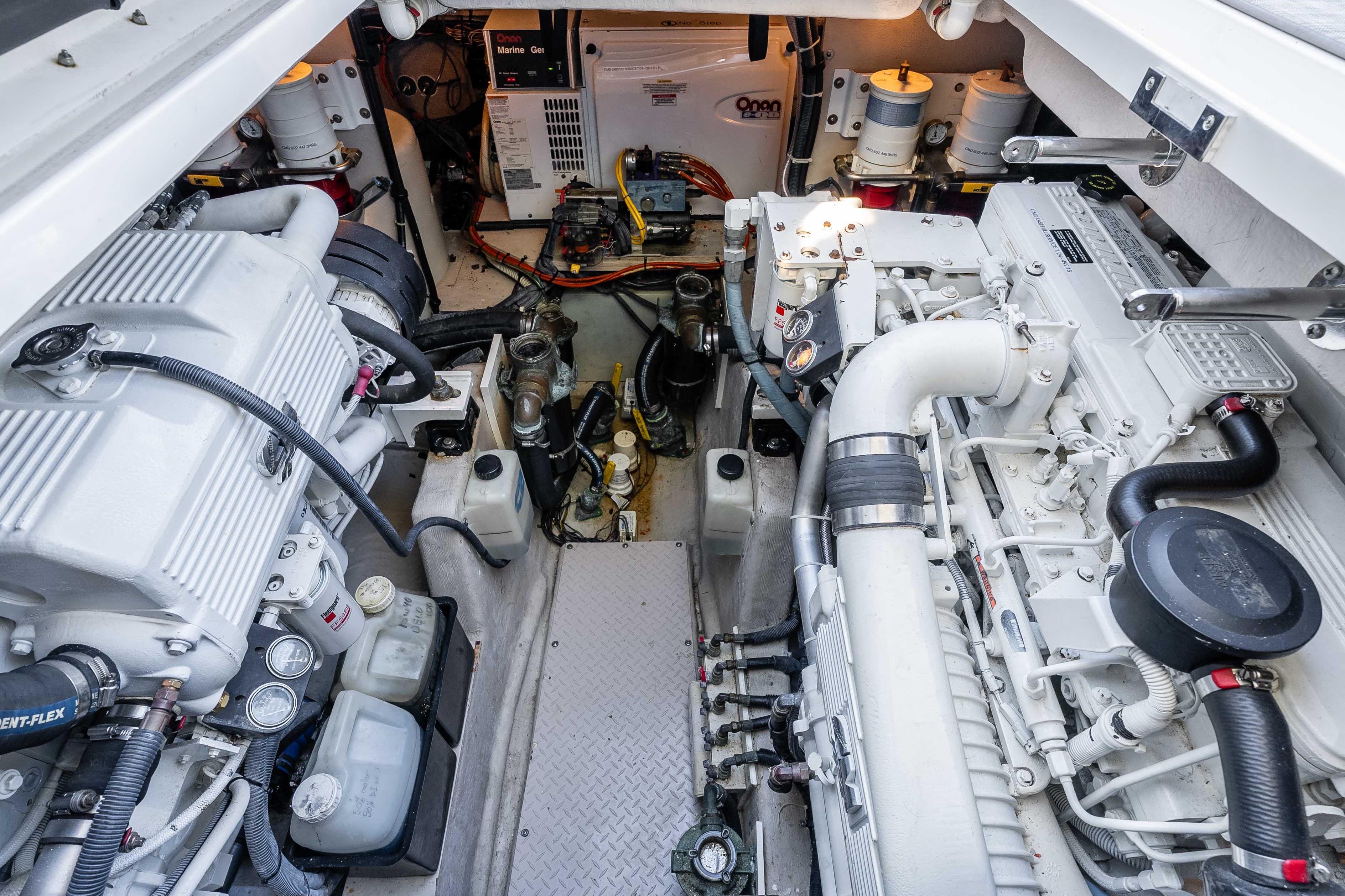 Engine room of 2007 Sea Ray 48 Sundancer yacht, showcasing dual engines and mechanical components.