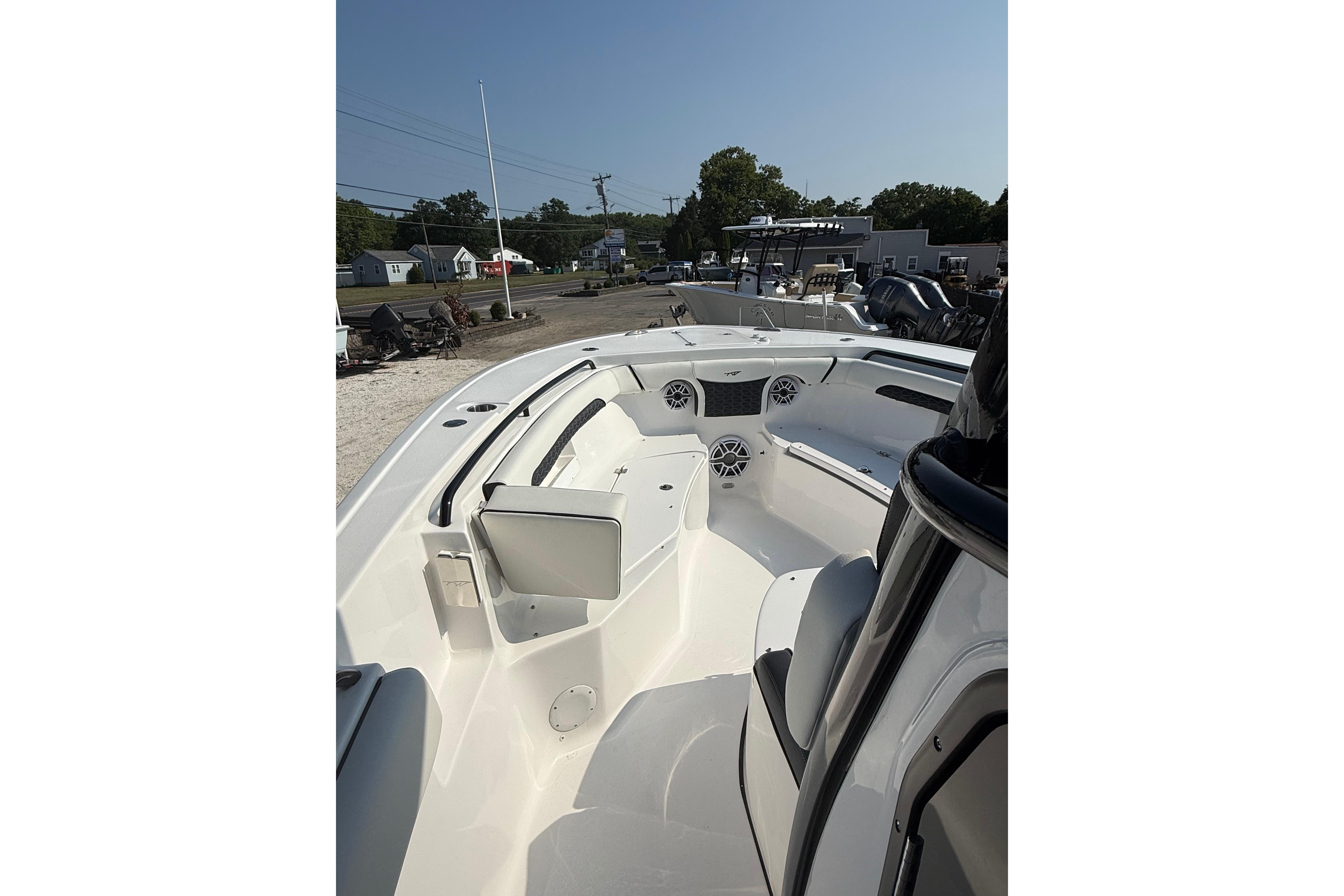 2026 Tidewater 256 CC Adventure boat interior with seating and storage compartments.