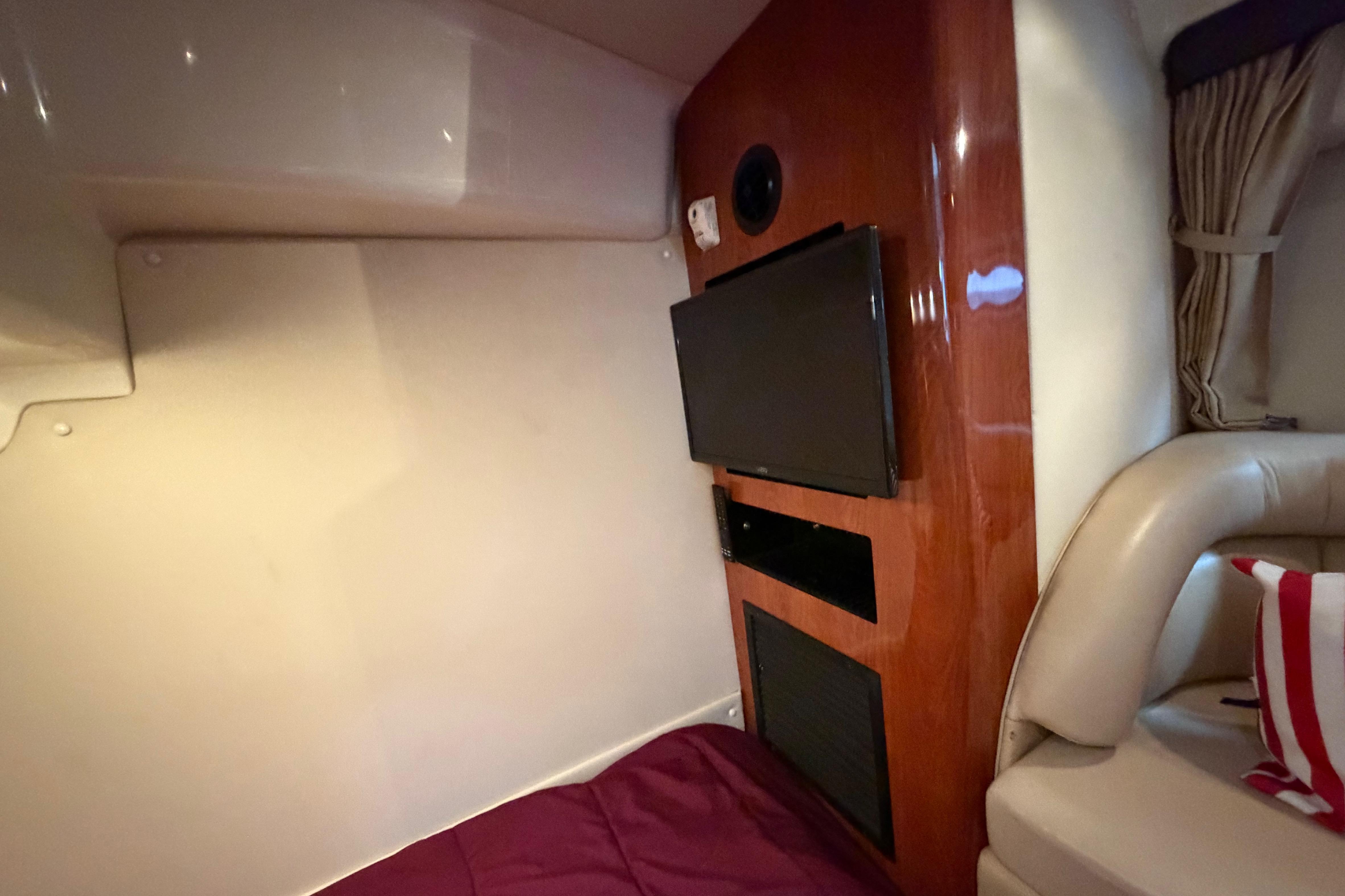 Interior of 2007 Monterey 350 Sport Yacht with TV and seating area.