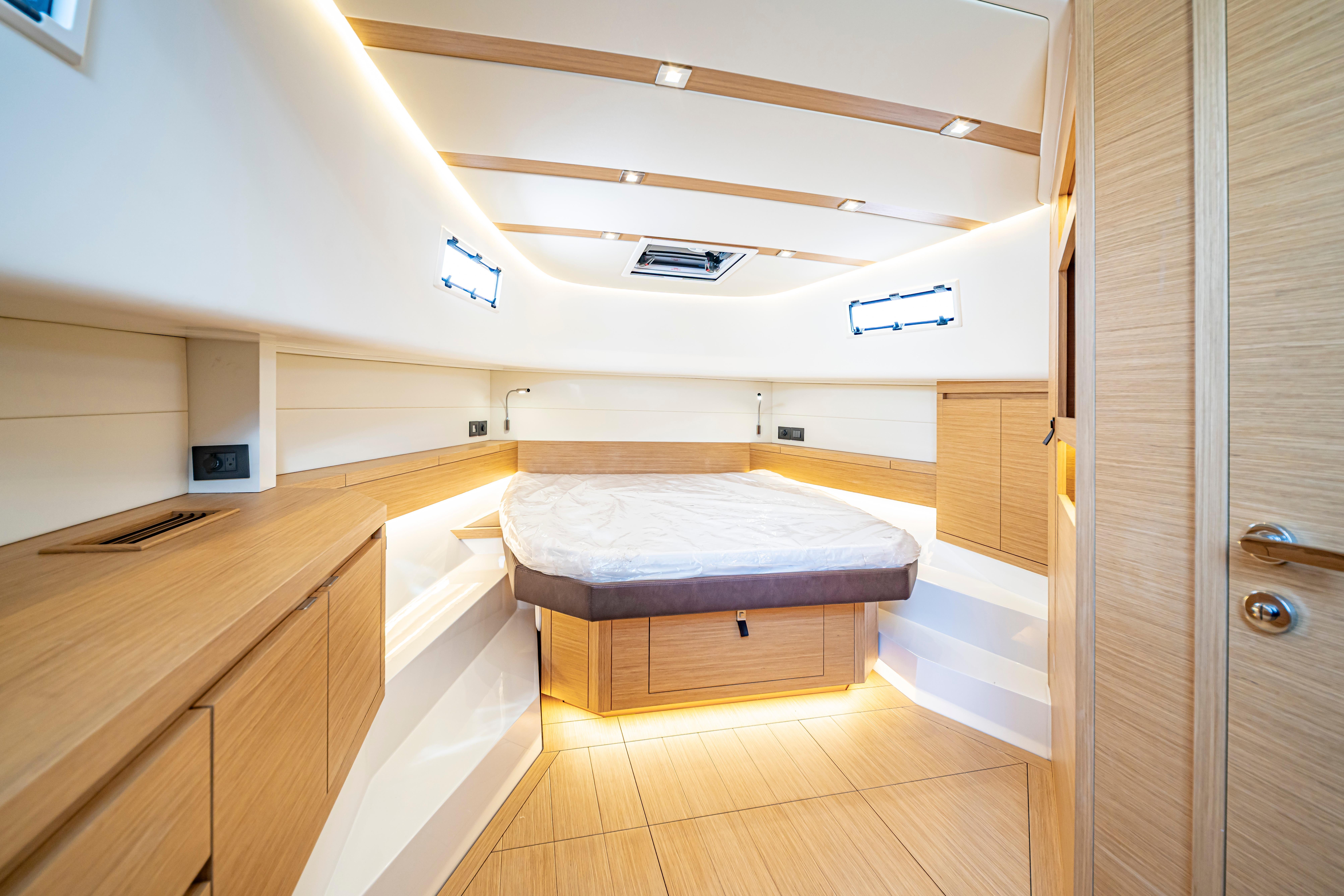 Luxurious interior cabin of 2024 Pardo Yachts P43, featuring modern wood finishes and ambient lighting.