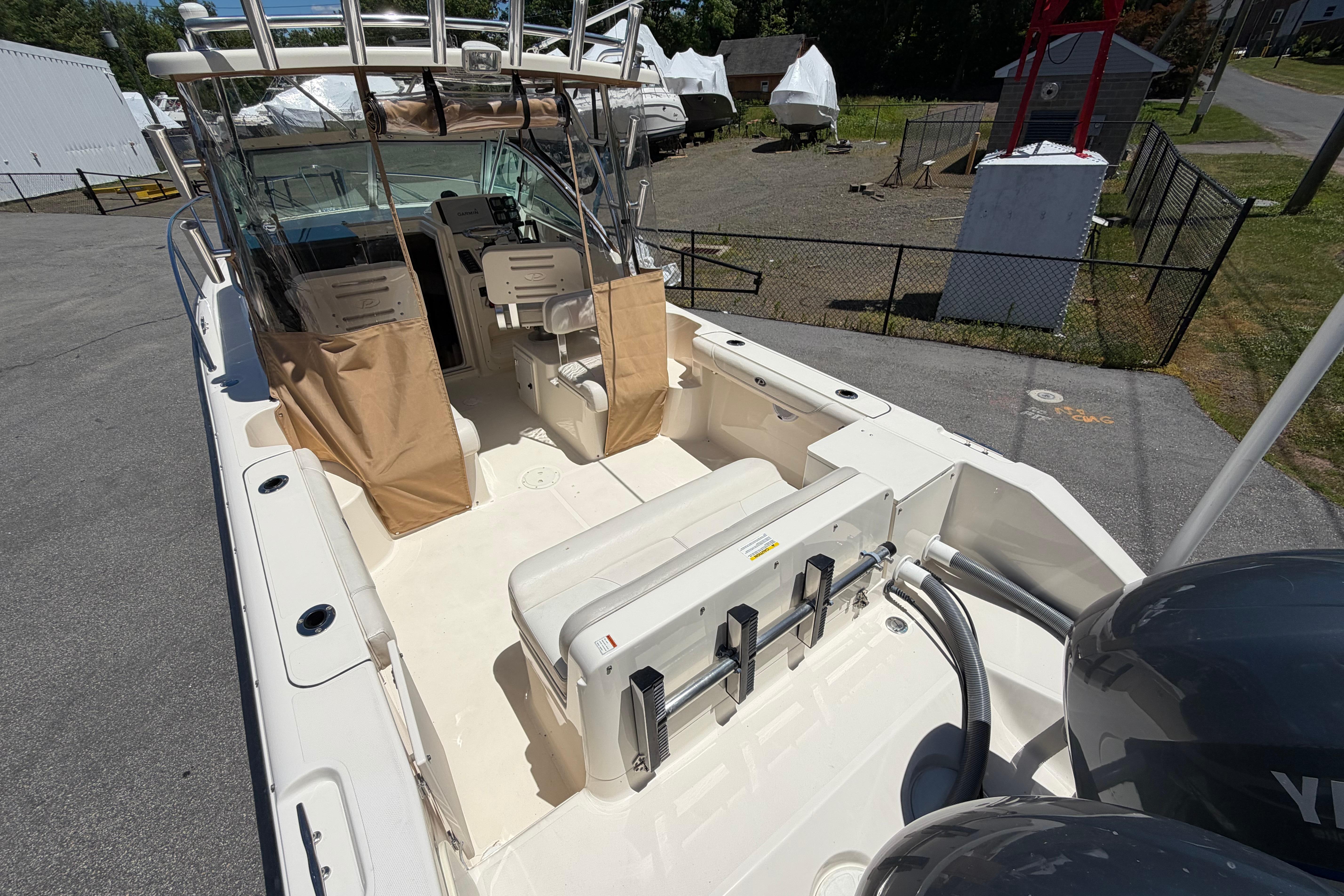 2010 Pursuit OS 255 Offshore boat with spacious deck and dual engines.