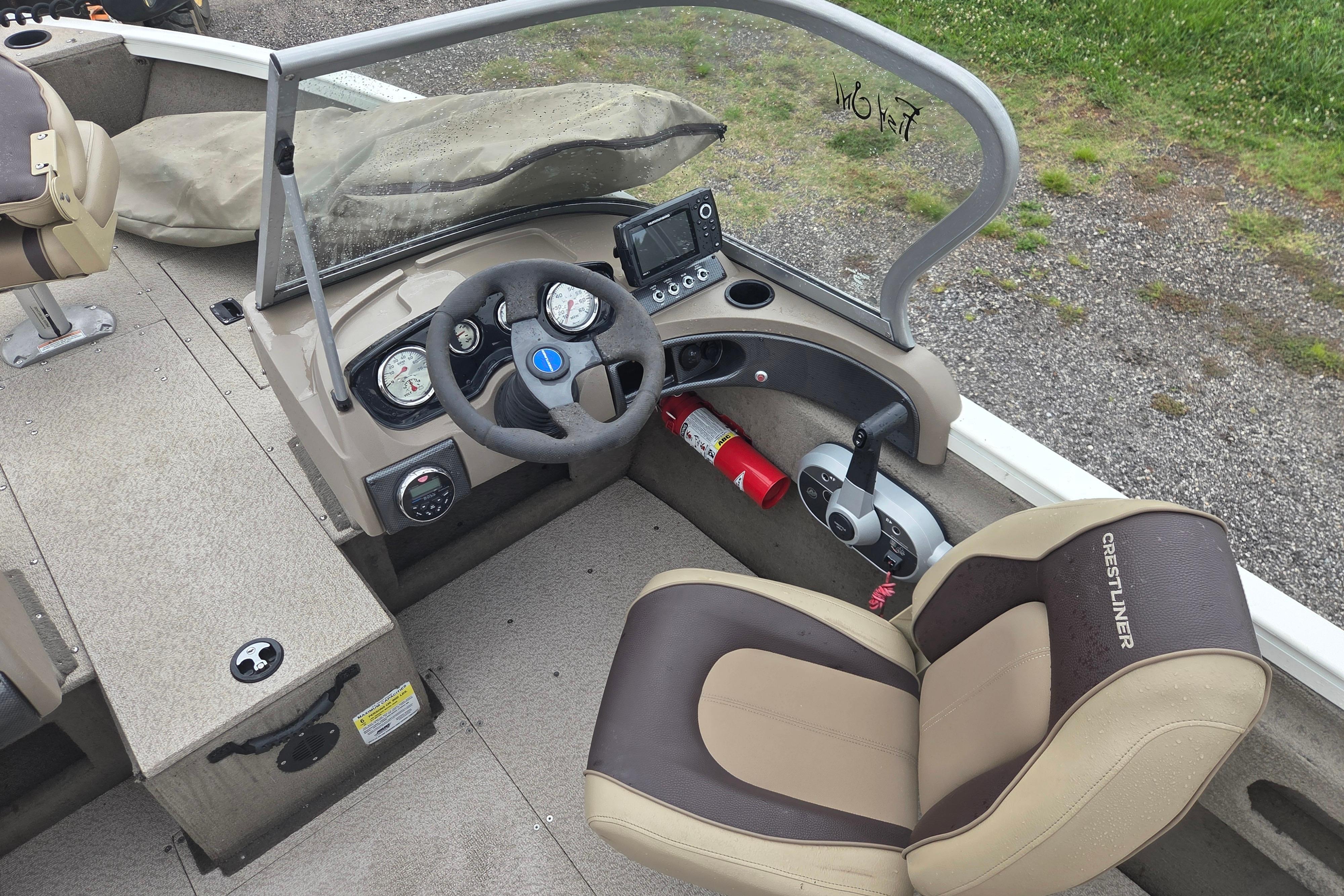 2016 Crestliner 1650 Fish Hawk SC boat interior with steering wheel and dashboard controls.