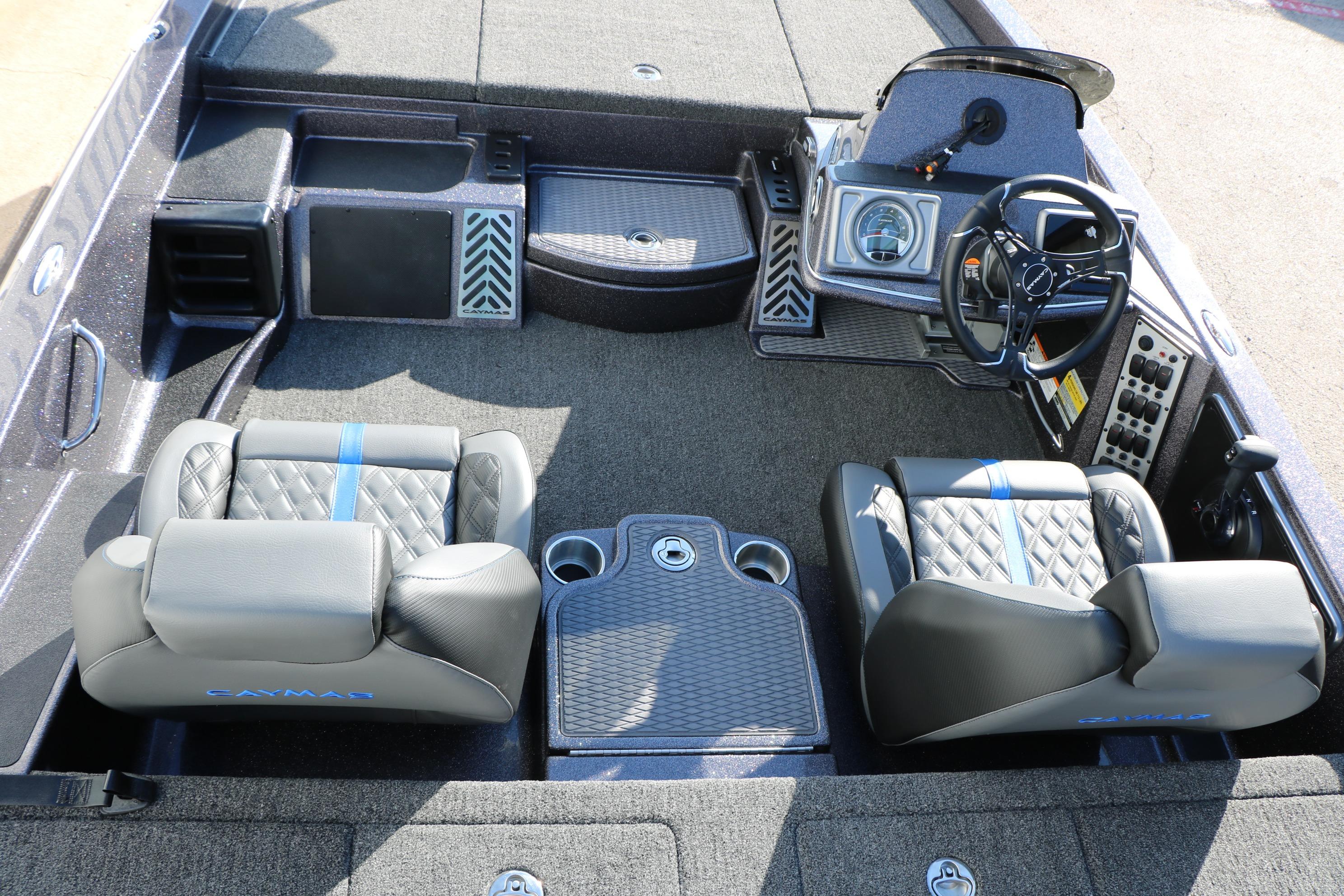 2027 Caymas 201 Pro boat interior with dual seats, steering wheel, and control panel.