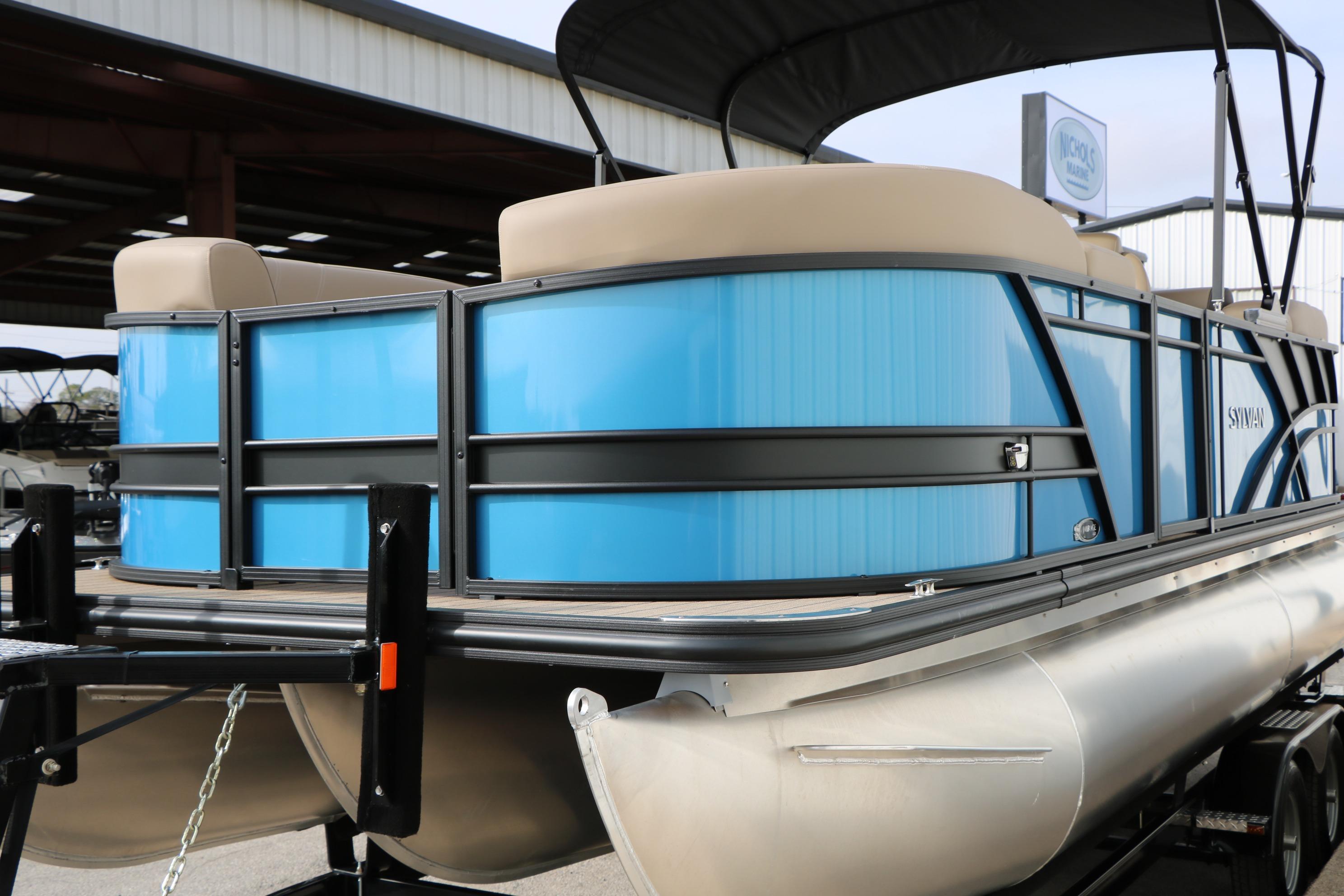 2026 Sylvan Mirage 822 LZ pontoon boat with blue panels and beige seating.