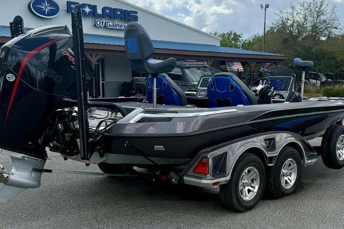 2023 Ranger Z520R boat on trailer at Polaris dealership, featuring sleek design and powerful engine.