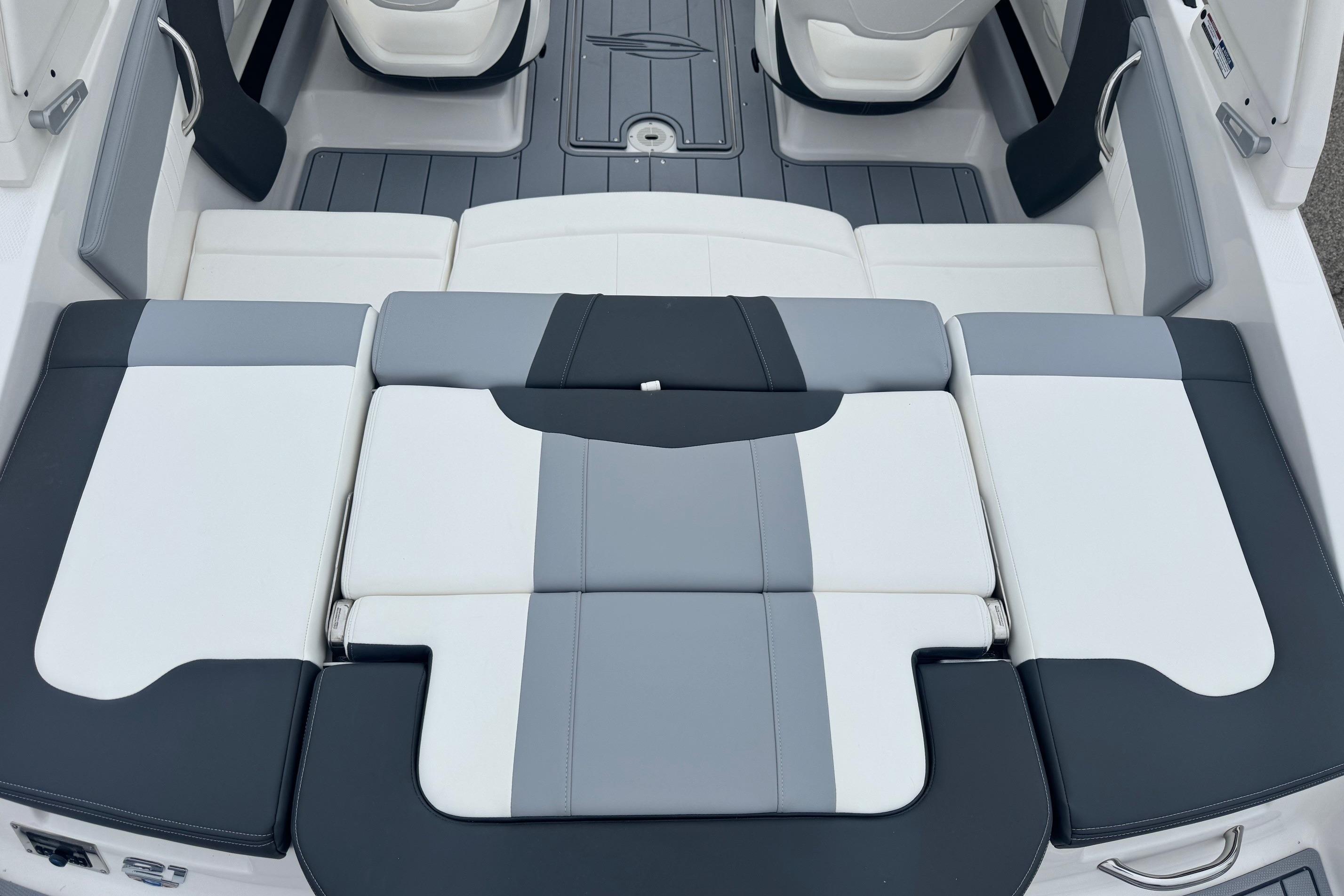 2026 Chaparral 21 SSi boat interior with sleek, modern seating design in gray and white.