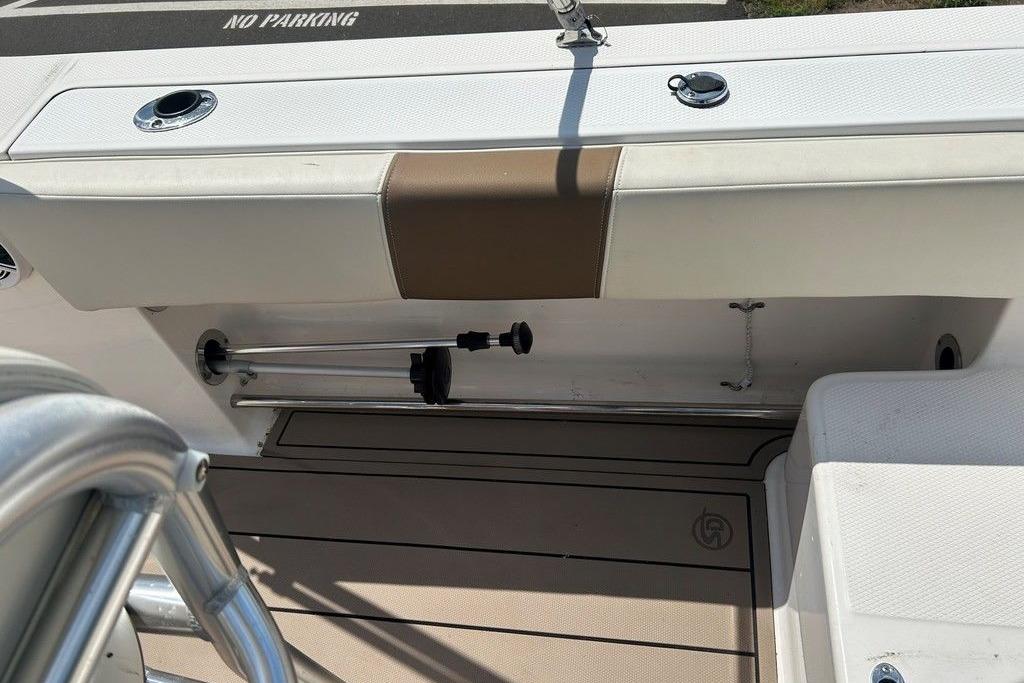 2017 Robalo R200ES boat interior with storage compartment and "No Parking" sign.