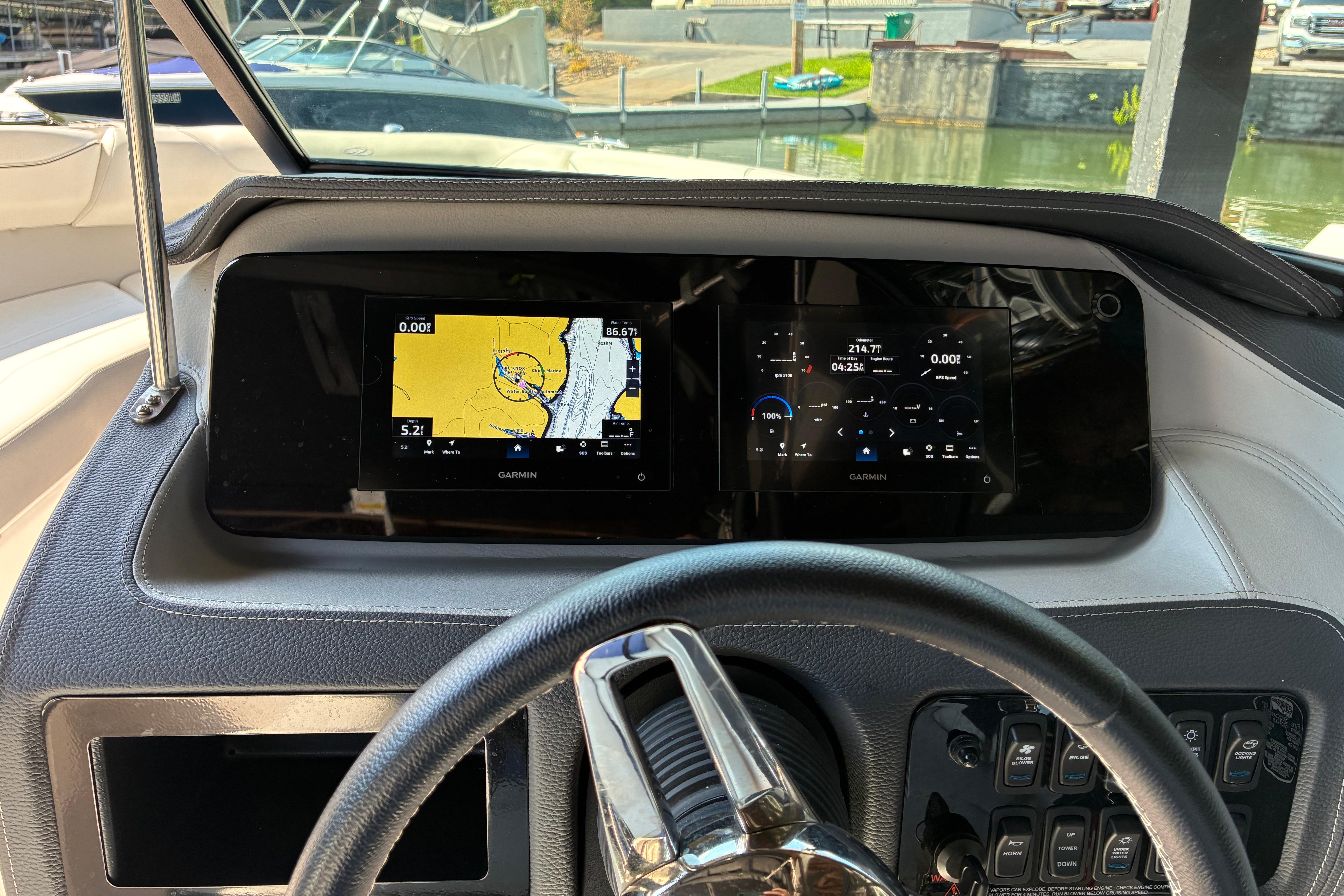Dashboard of 2025 Regal LS2 boat with Garmin navigation displays.