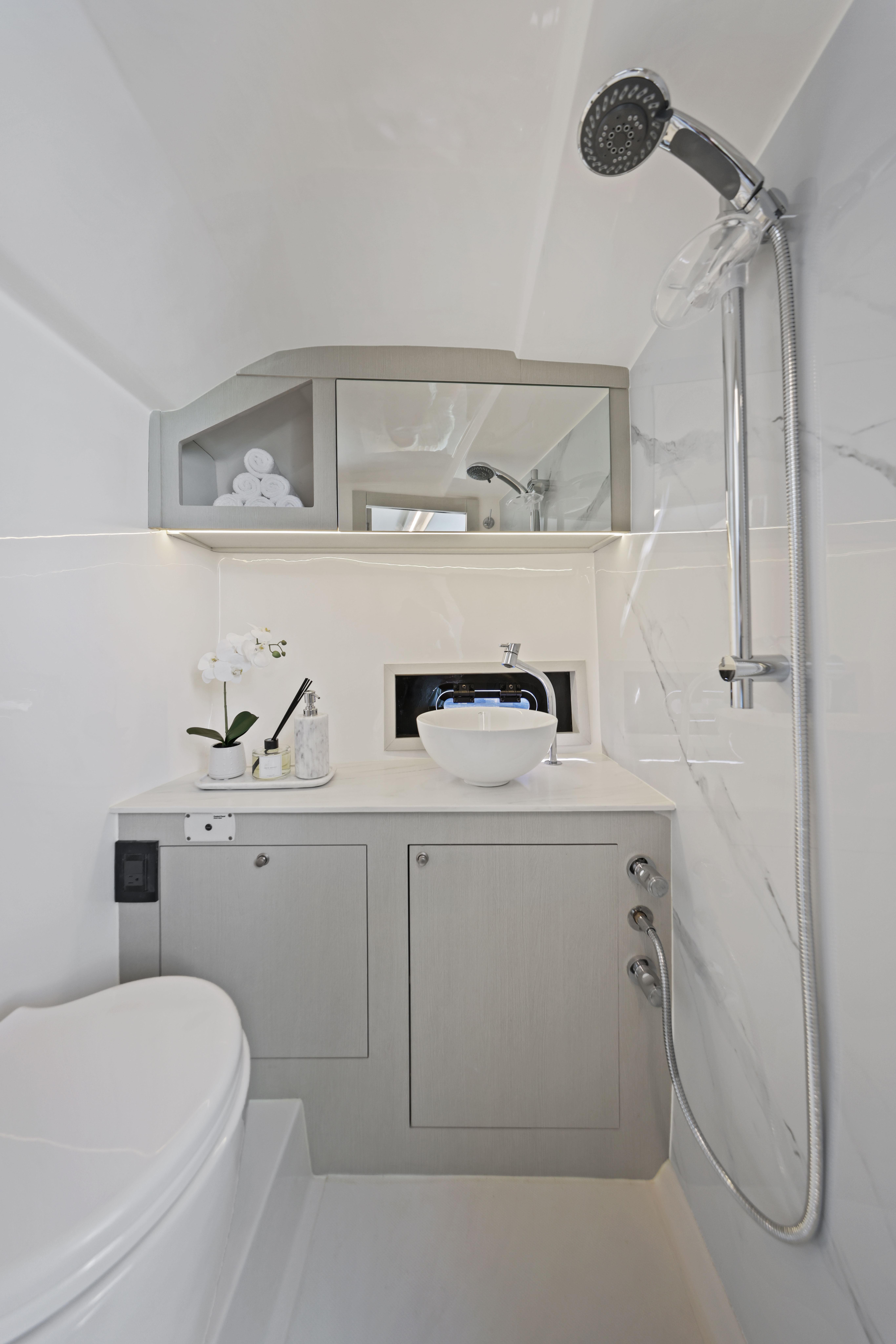 Modern bathroom in 2025 Valiatt 380 Bowrider boat, featuring sleek fixtures and elegant design.
