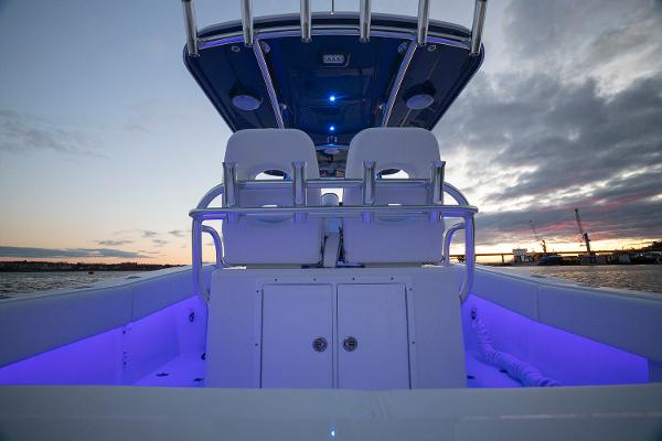 Manufacturer Provided Image: 2025 Southport 27 FE boat interior with illuminated seating at sunset.
