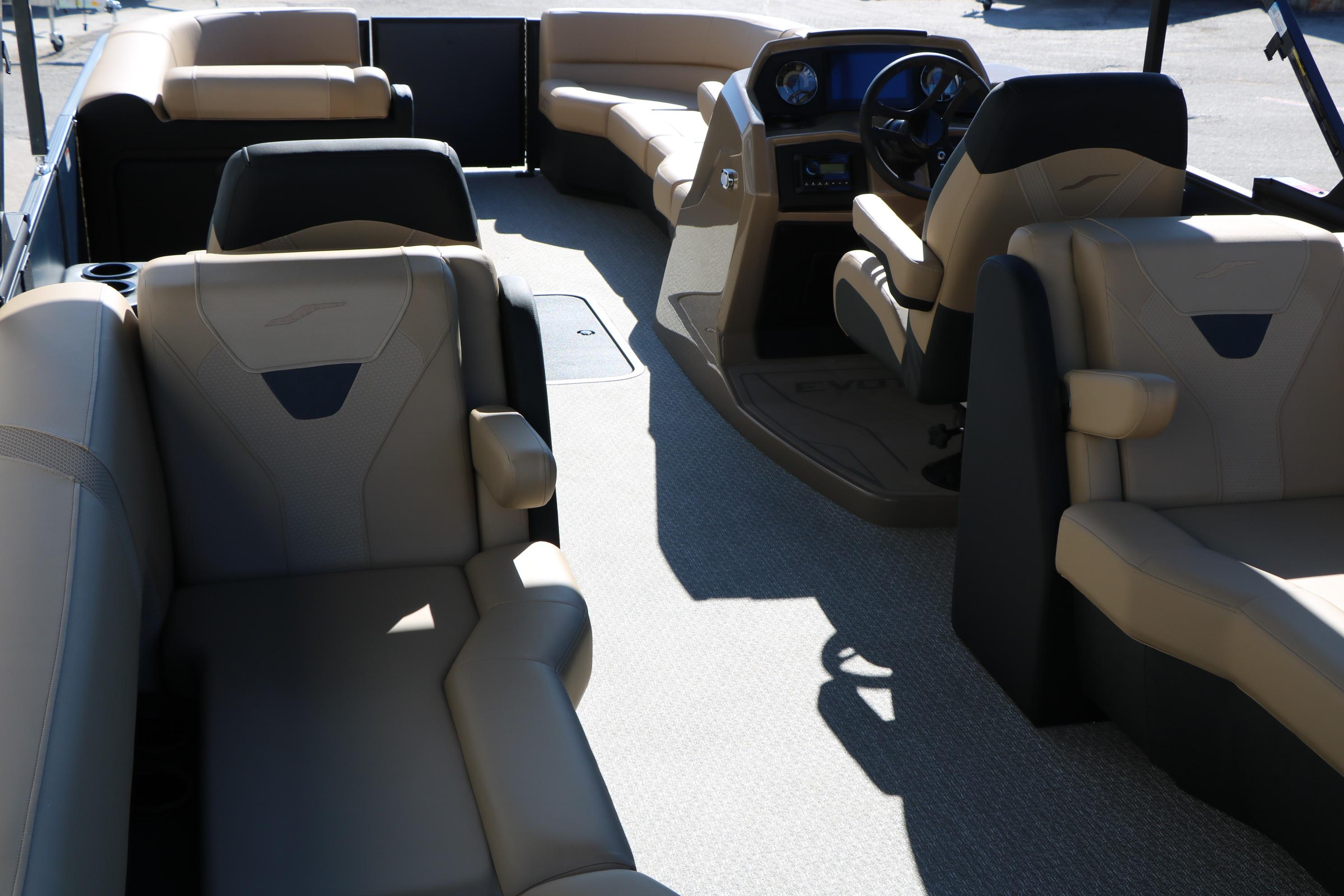 Luxurious interior of 2026 Evotti 525 QL Tri-Toon boat with plush seating.