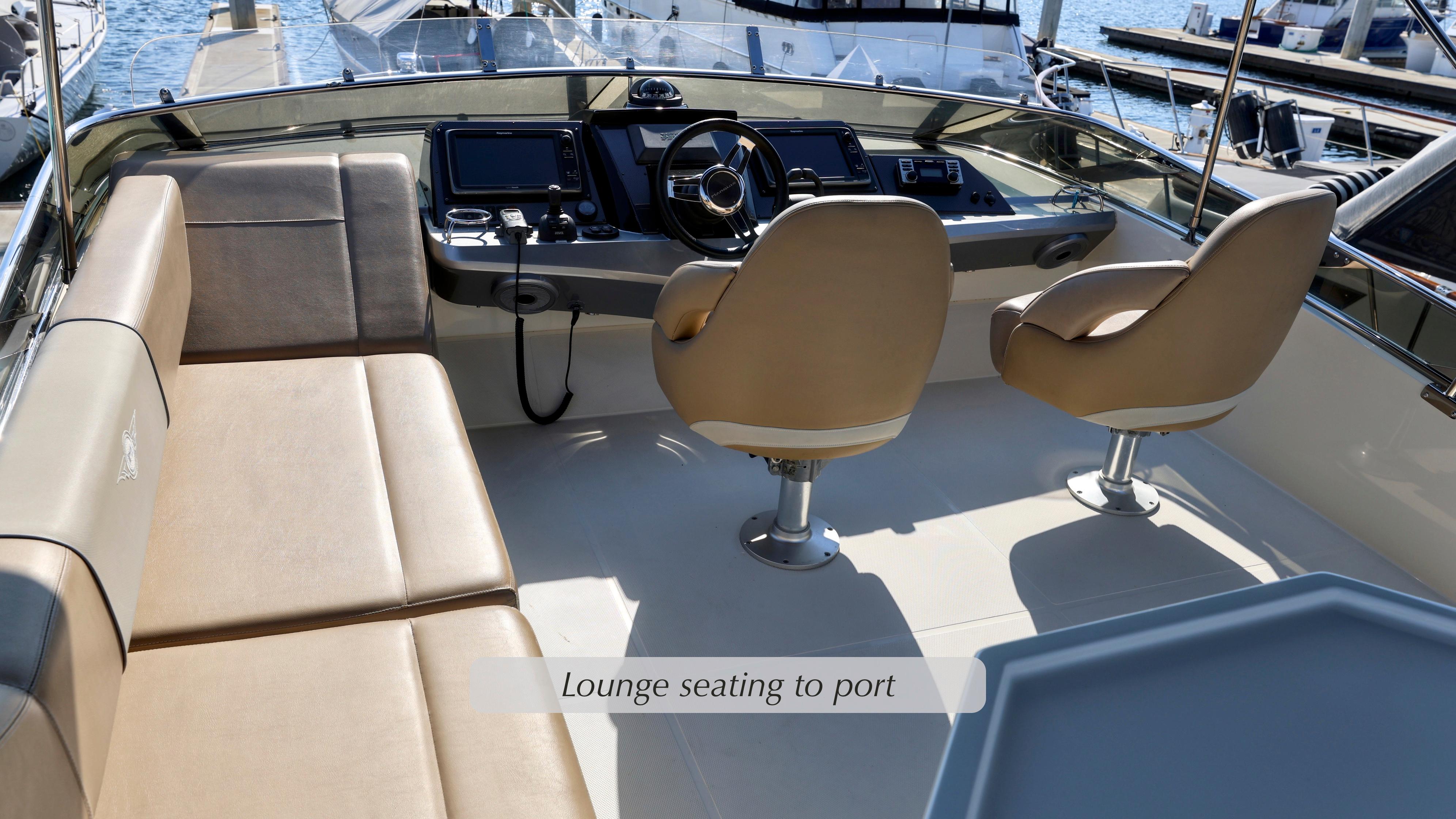 2013 Marquis 500 Sport Bridge interior with helm and lounge seating.