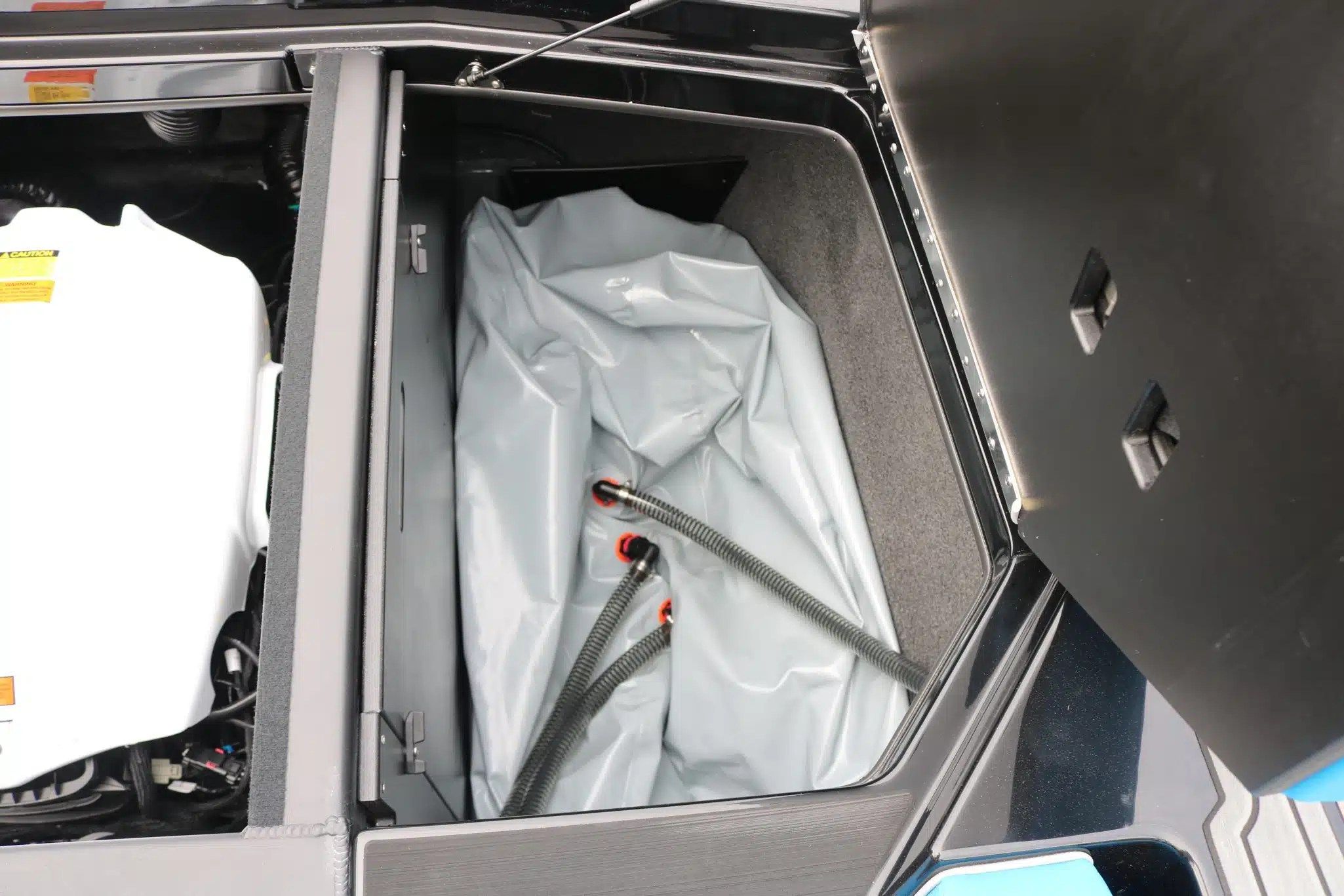 Engine compartment of 2024 ATX Surf Boats 24 Type-S with ballast system.