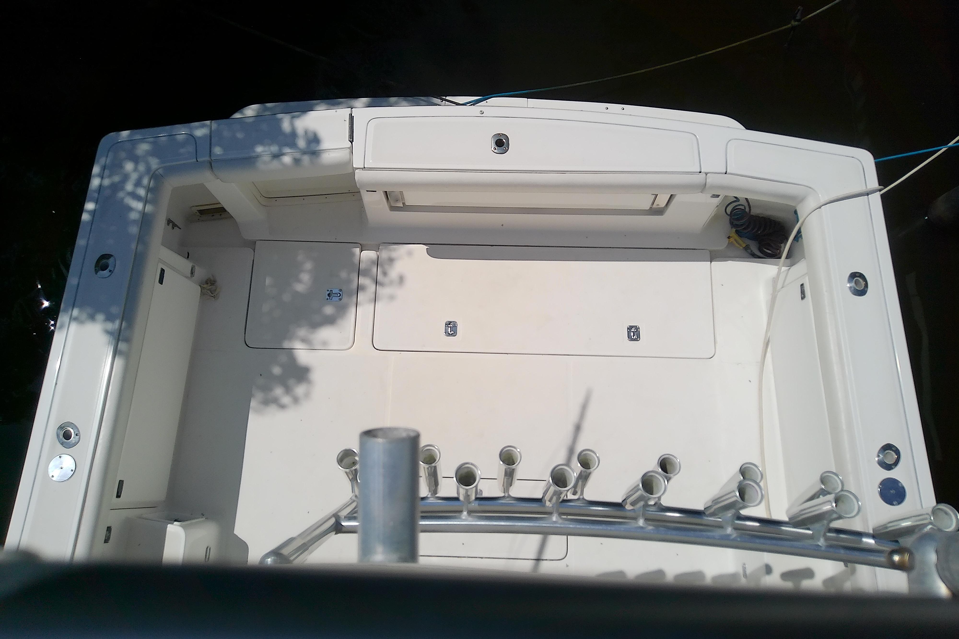 Overhead view of 2000 Tiara Yachts 4100 Open deck, featuring rod holders and storage compartments.