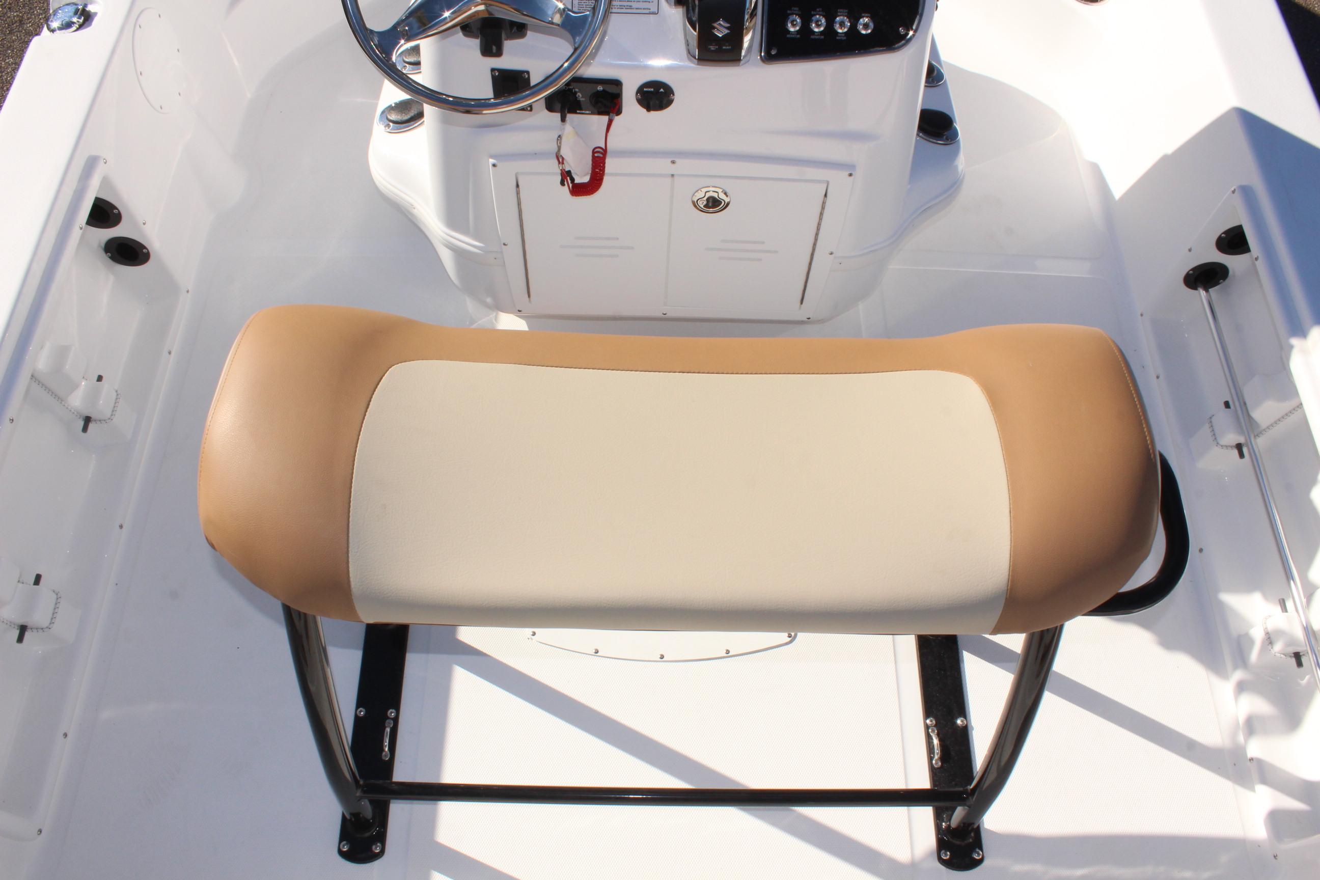 NauticStar 214 Shallow Bay 2025 boat interior with tan and white seating.