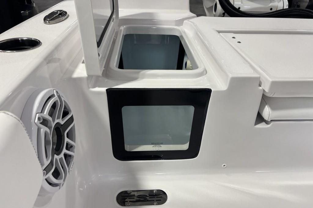 2026 Sportsman Masters 247 Bay Boat interior with speaker and storage compartment.