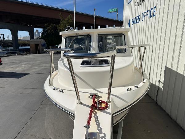 2023 Defiance Admiral 220 EX boat at sales office, front view.