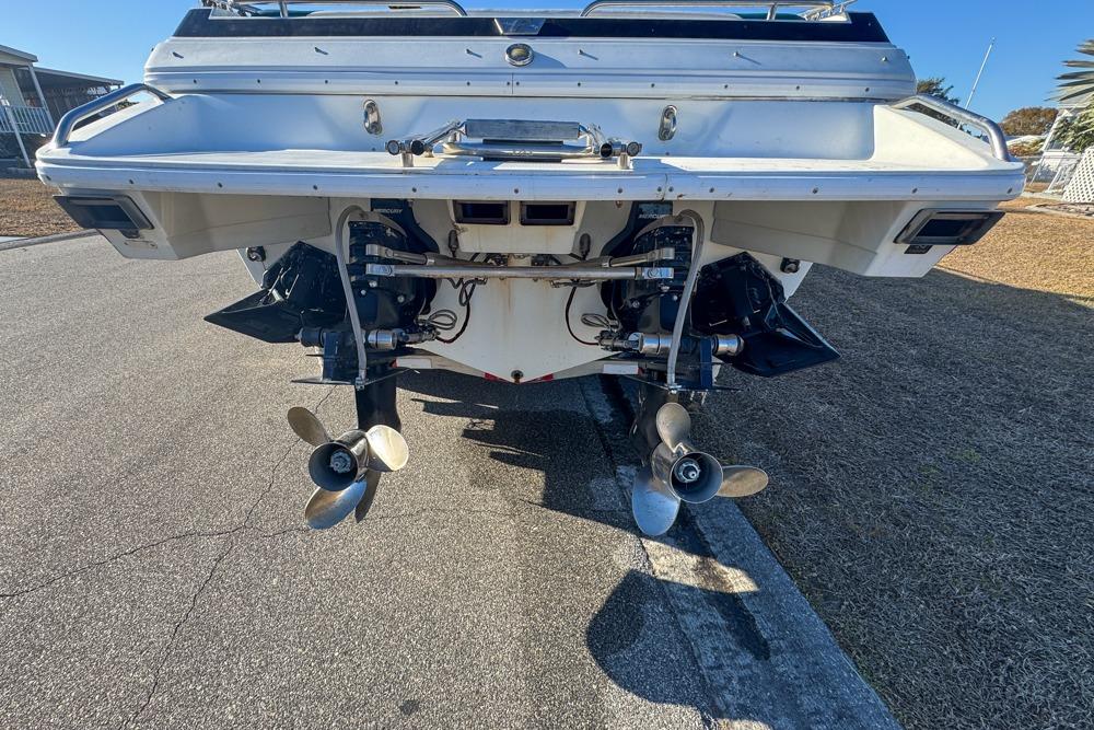 Rear view of a 1989 Formula 292 SR-1 boat showing dual propellers and outboard motors.