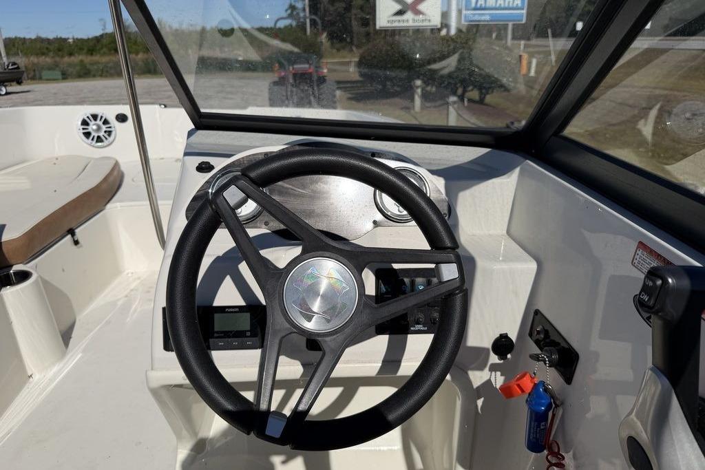 2024 Stingray 191 DC boat dashboard with steering wheel and controls.